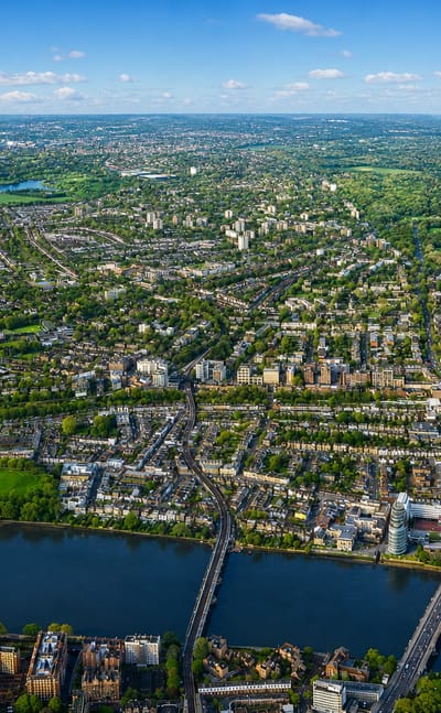 Aerial view of the River Thames at Putney with its bridge and surrounding streets and parkland.
