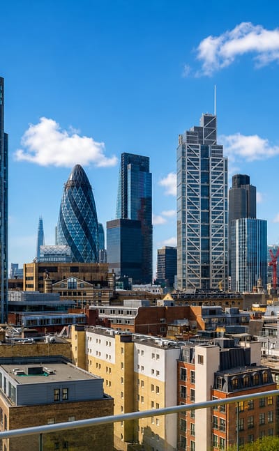 The City of London skyline with the Gherkin and Tower 42 seen from the edge of Spitalfields.
