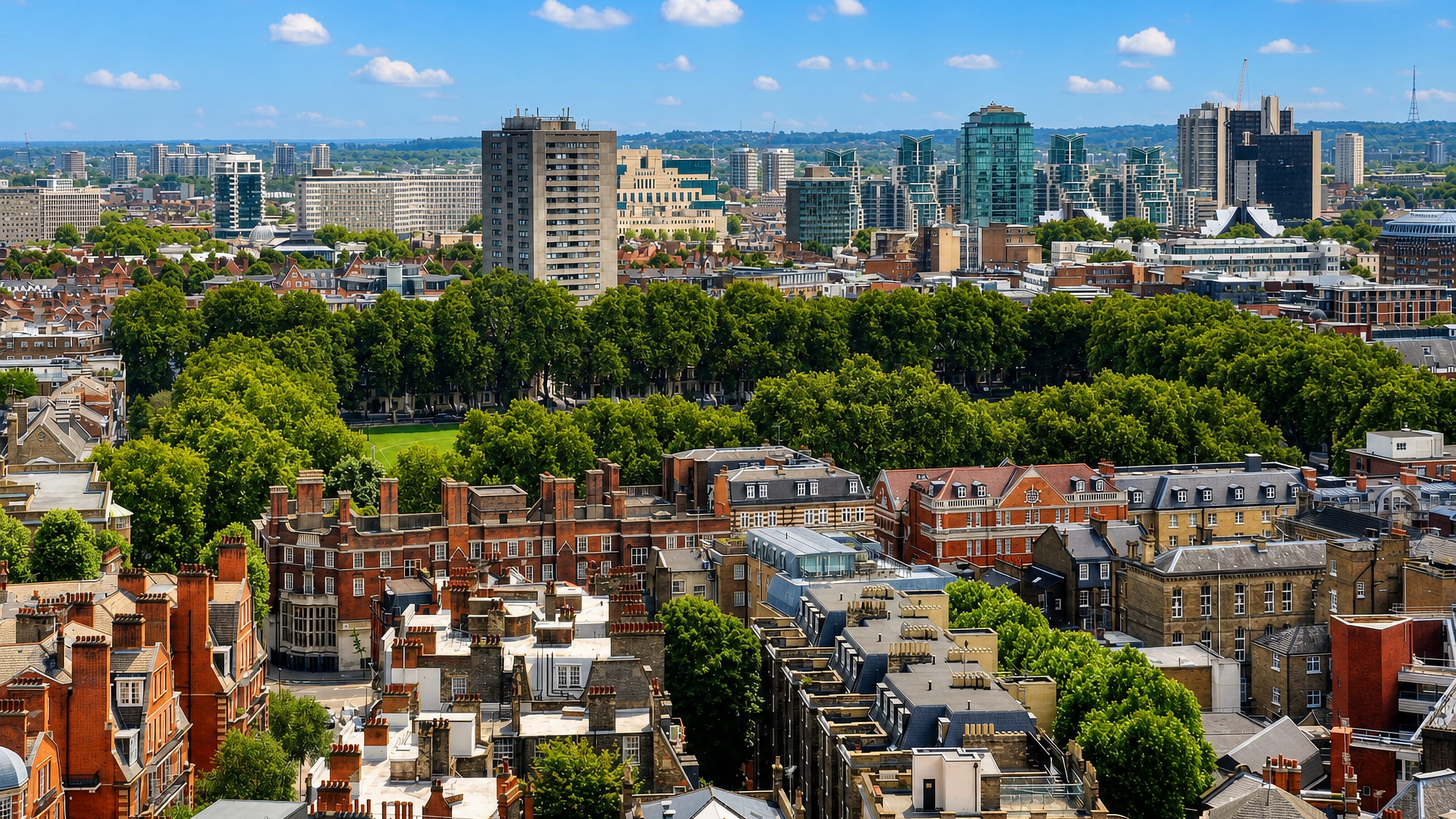 Vincent Square's tree-ringed green in Westminster with London's Vauxhall towers on the skyline