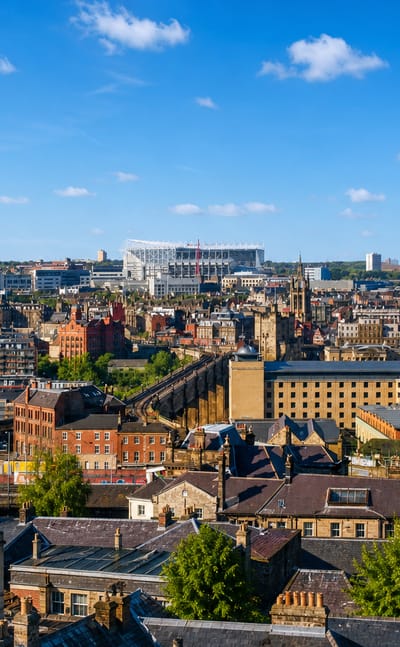Rooftop view across Newcastle city centre with St James' Park stadium on the skyline