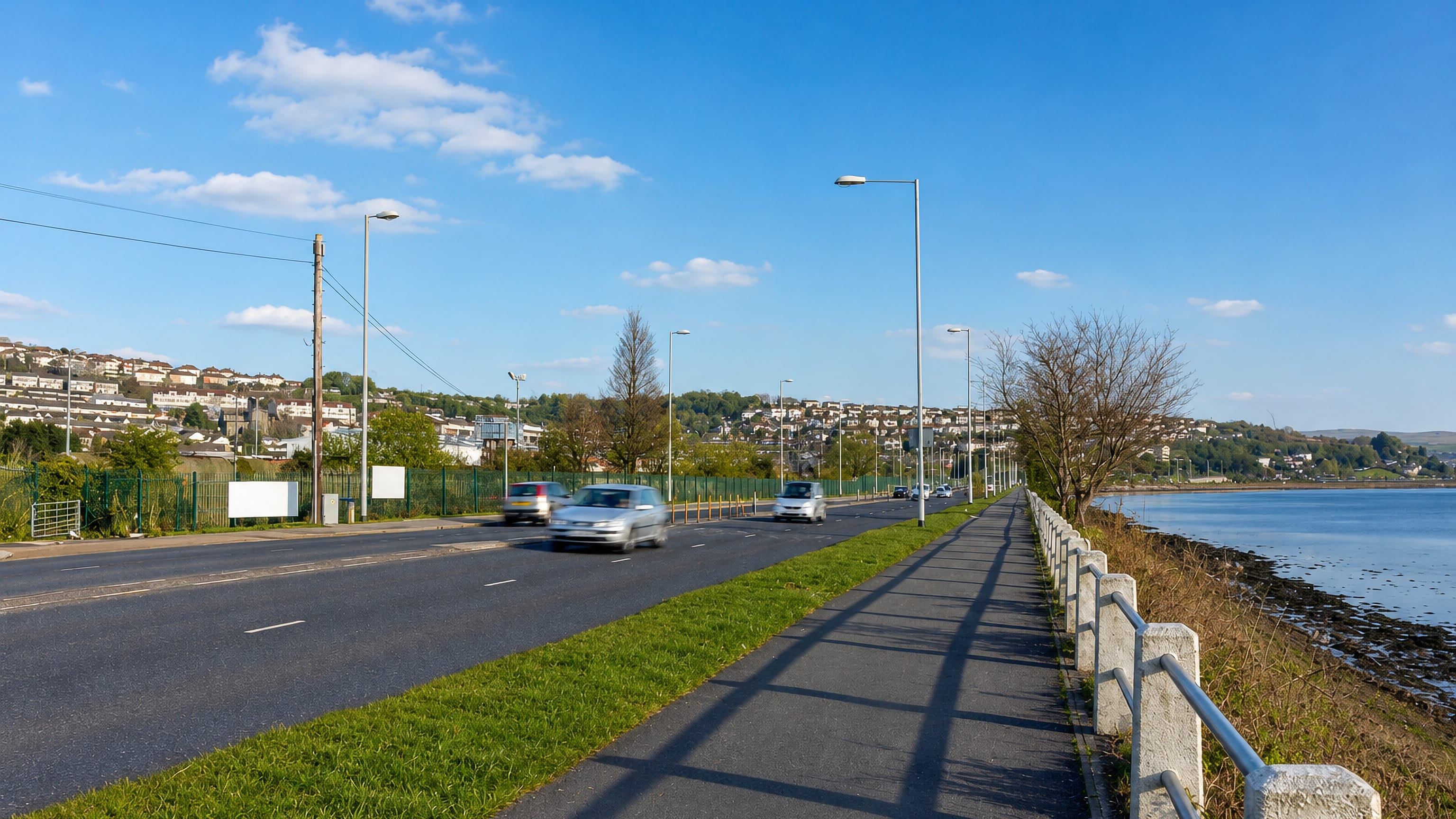 Road and footpath running beside the Plym estuary at Laira, Plymouth.