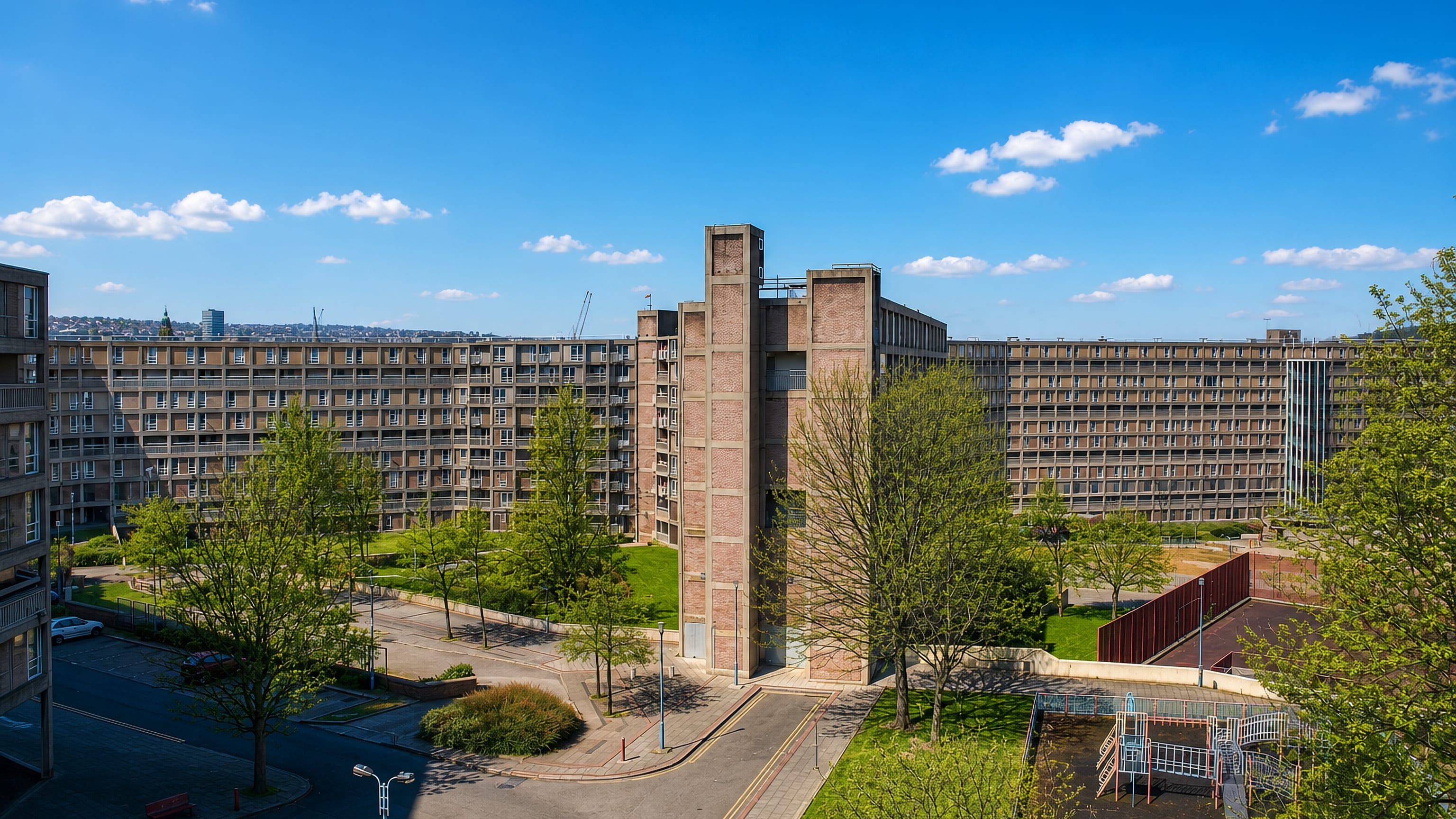 The brutalist Park Hill flats with their deck-access blocks and lift tower above the Sheffield skyline.
