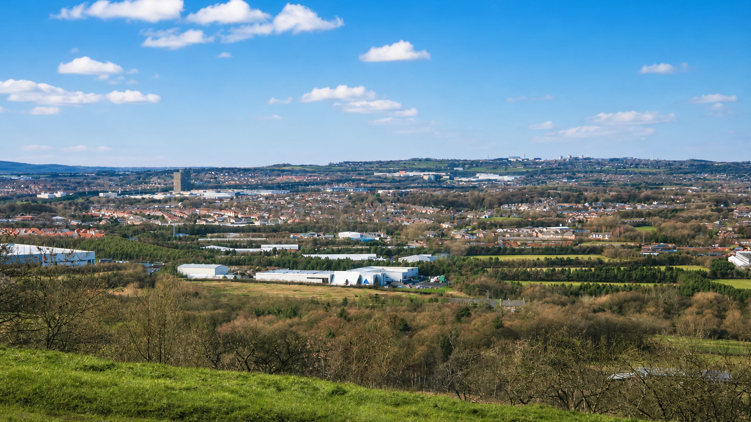 Washington, Tyne and Wear, from surrounding hills: housing, industrial estates and green fields.