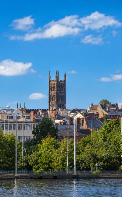 Wolverhampton skyline with St Peter's Church tower and red-brick buildings above a canal