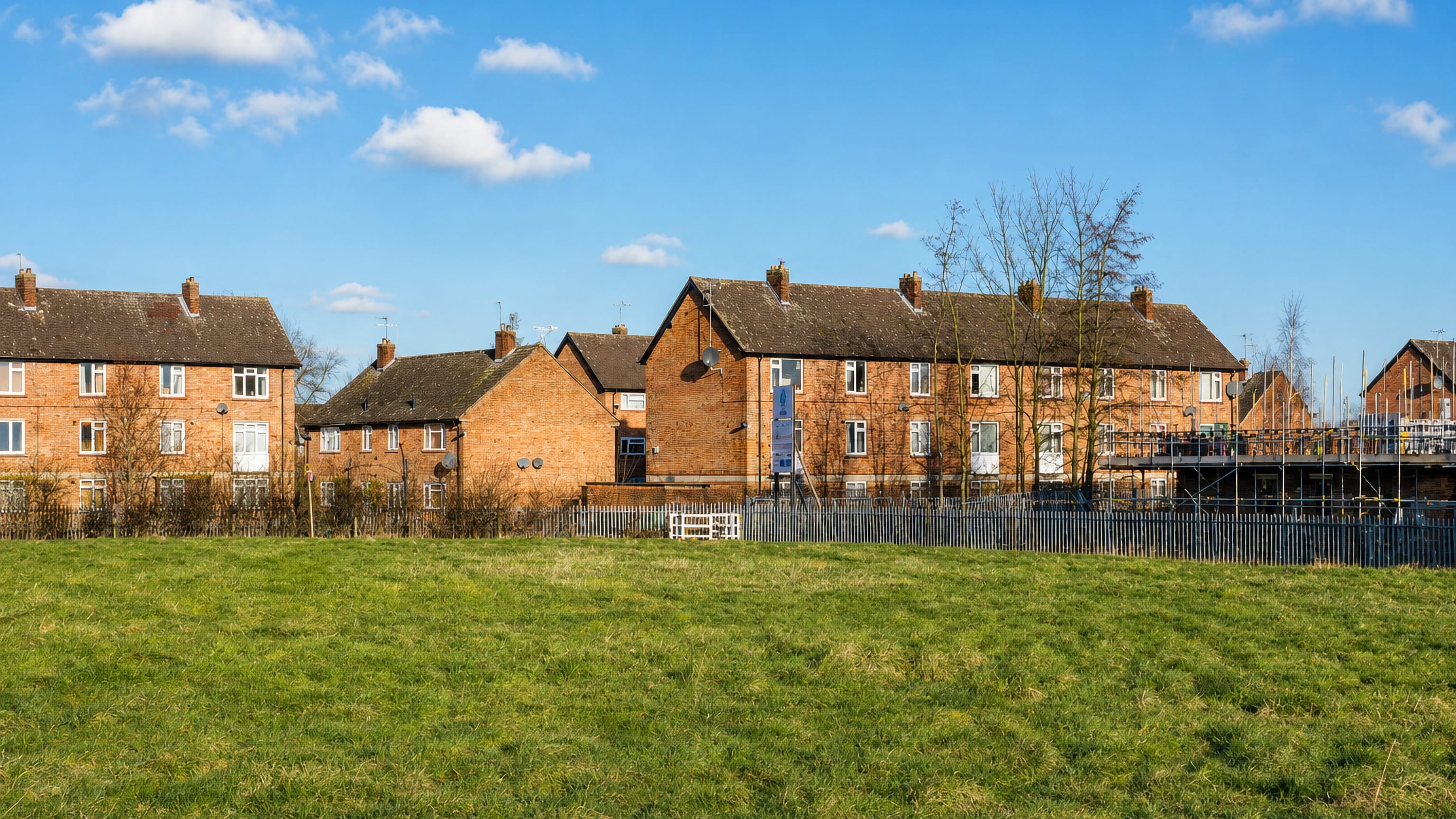 Brick terraces and a green open space in Dringhouses, a residential suburb of York.