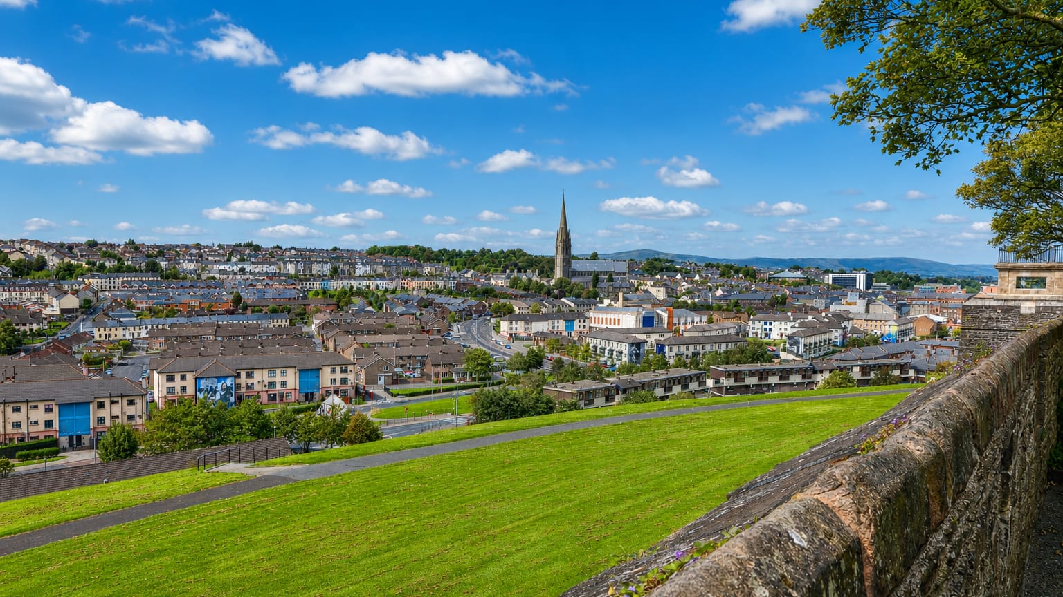 Derry's historic walled city with St Eugene's Cathedral spire and terraced houses seen from the old city walls