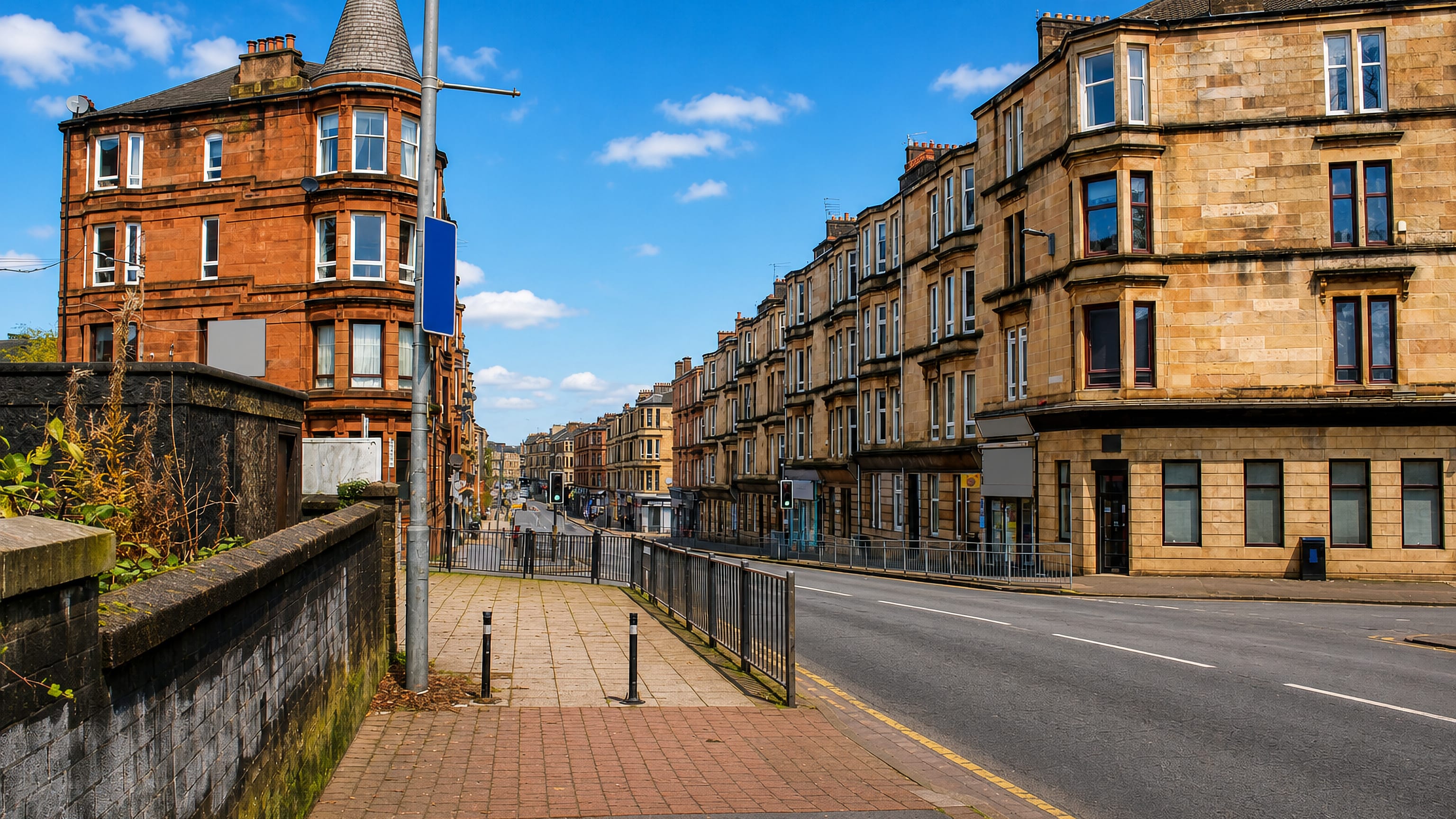 Red and blond sandstone tenements lining a sunlit street in Crosshill on Glasgow's Southside.