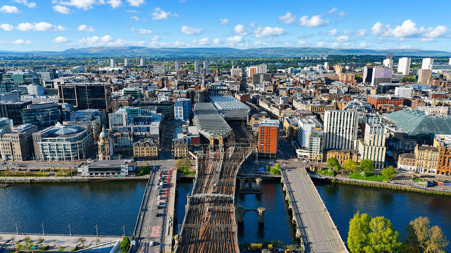Aerial view of Glasgow with railway bridges crossing the River Clyde into the city centre