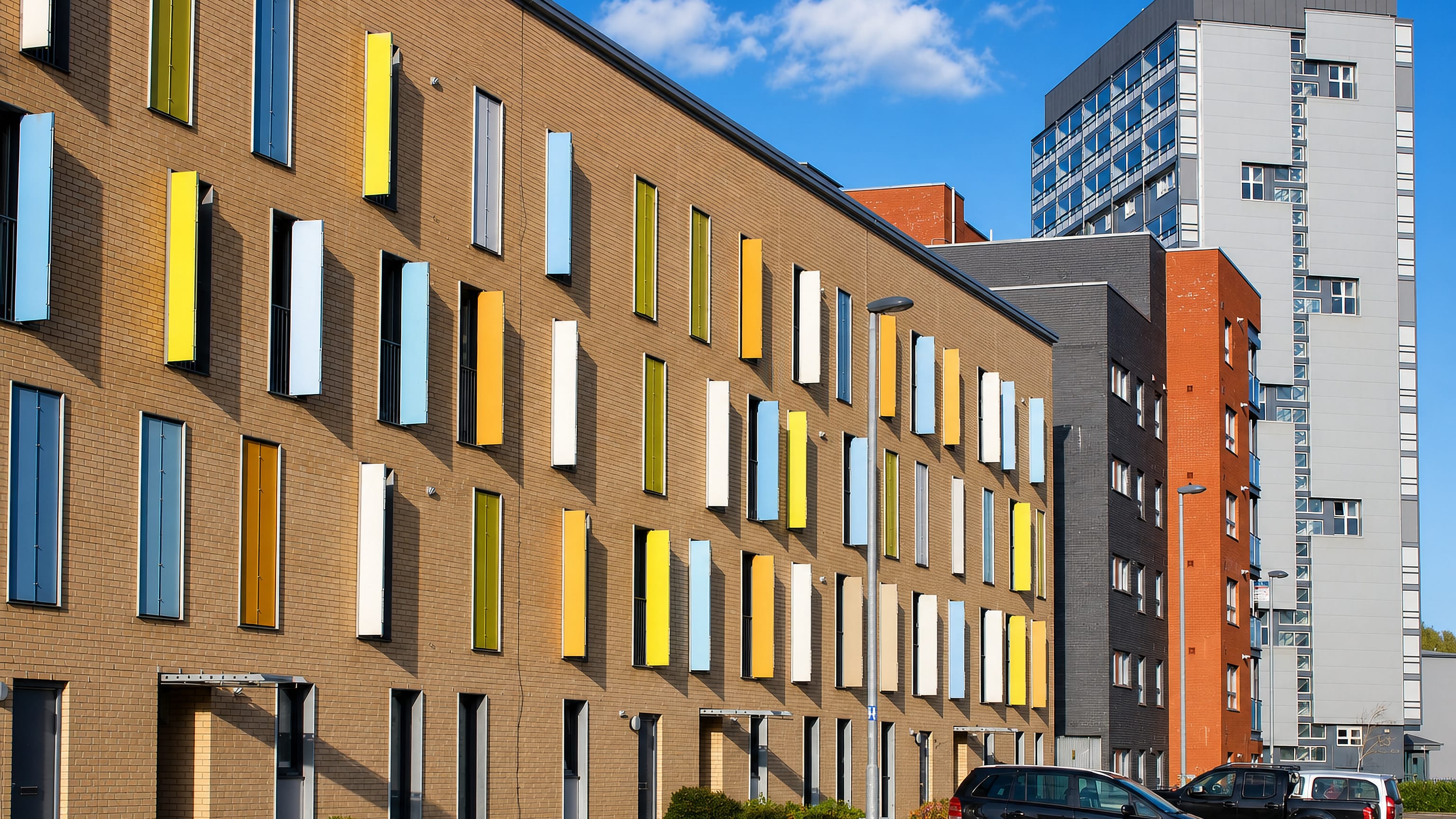 Colourful modern brick housing terraces and apartment towers in Hutchesontown, Glasgow's Gorbals.