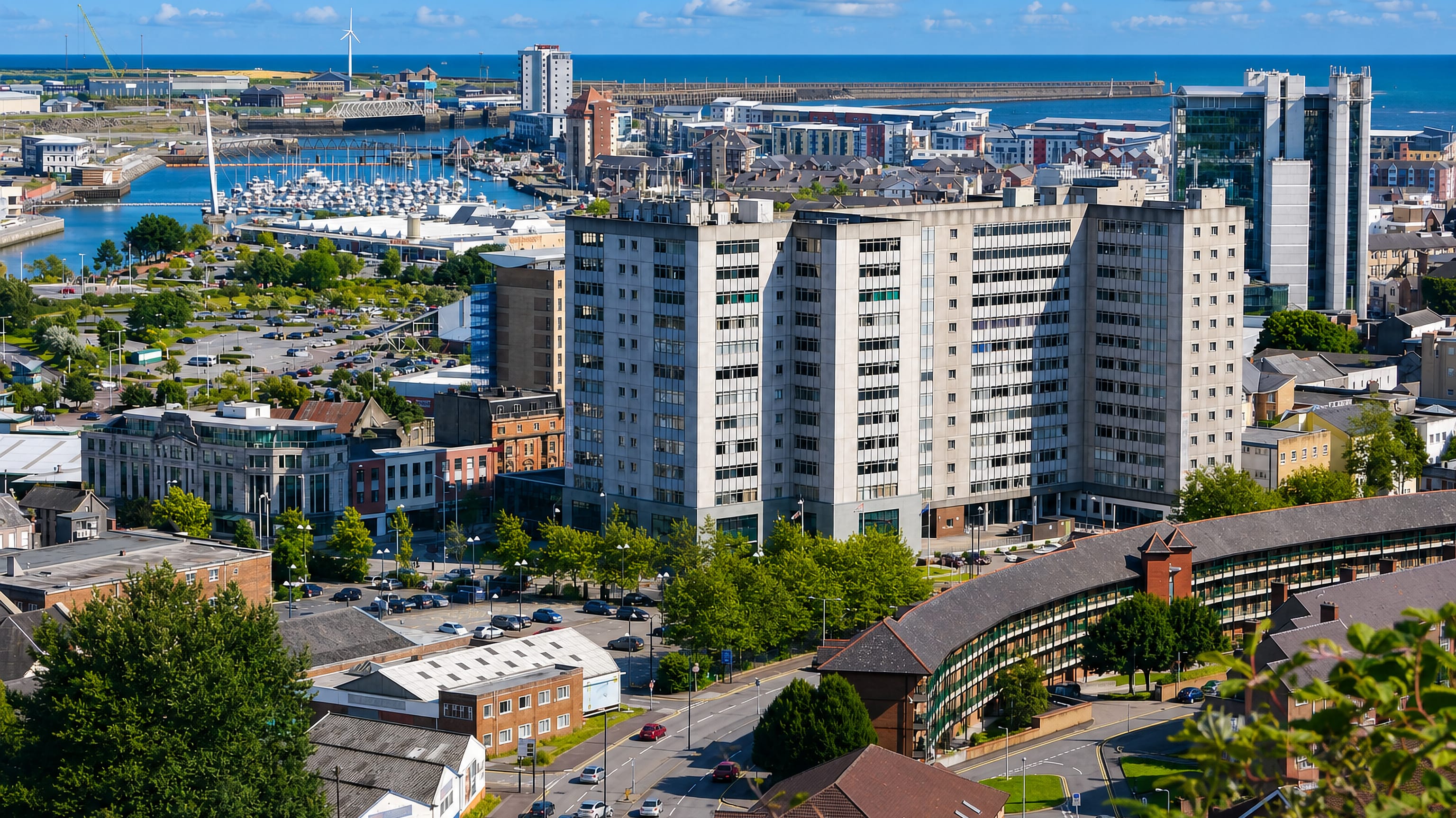 View from Townhill over Swansea's marina, waterfront apartments and breakwater with Swansea Bay beyond.