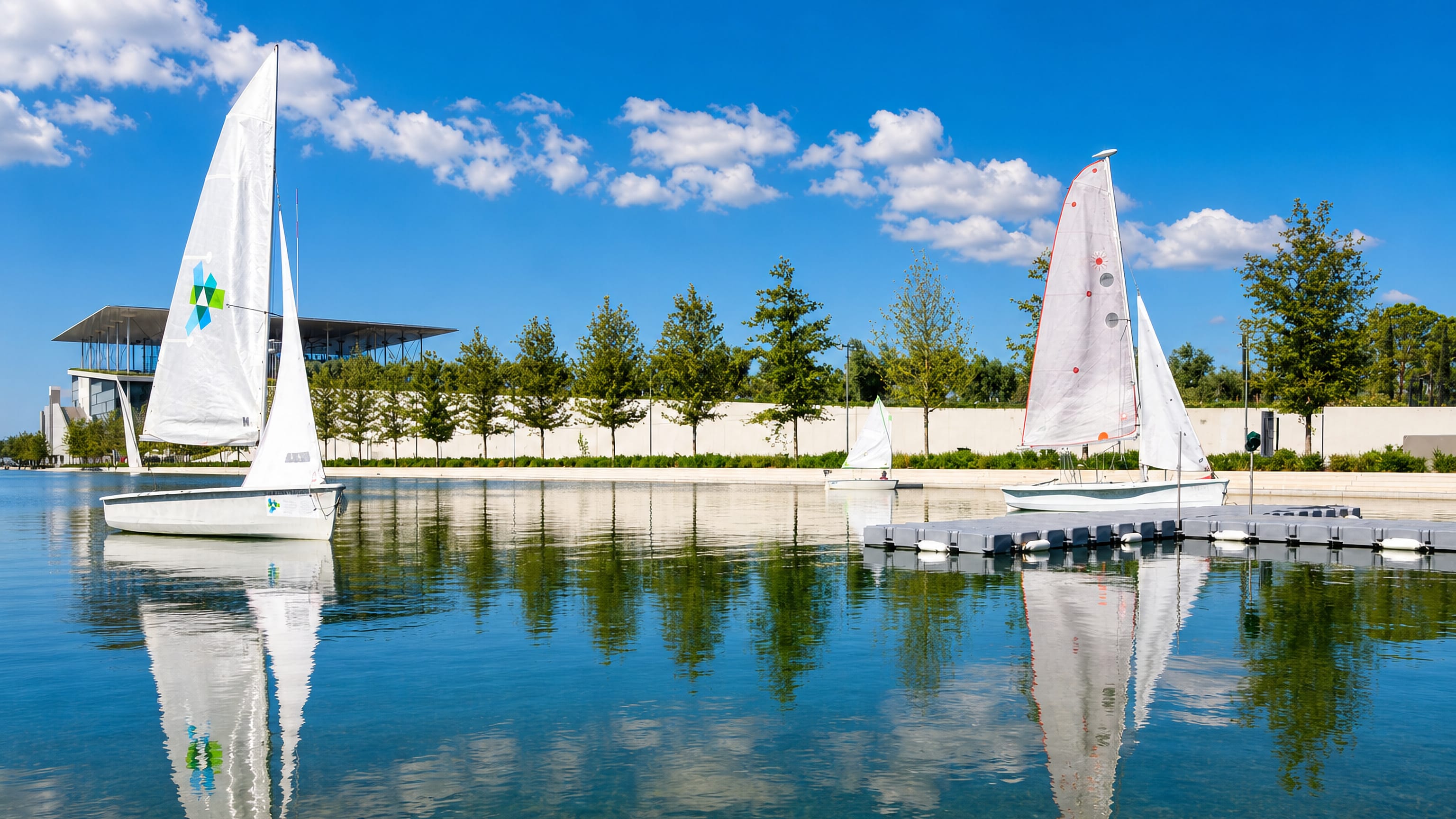 Sailboats on the canal beside the Stavros Niarchos Foundation Cultural Center in Kallithéa, Athens