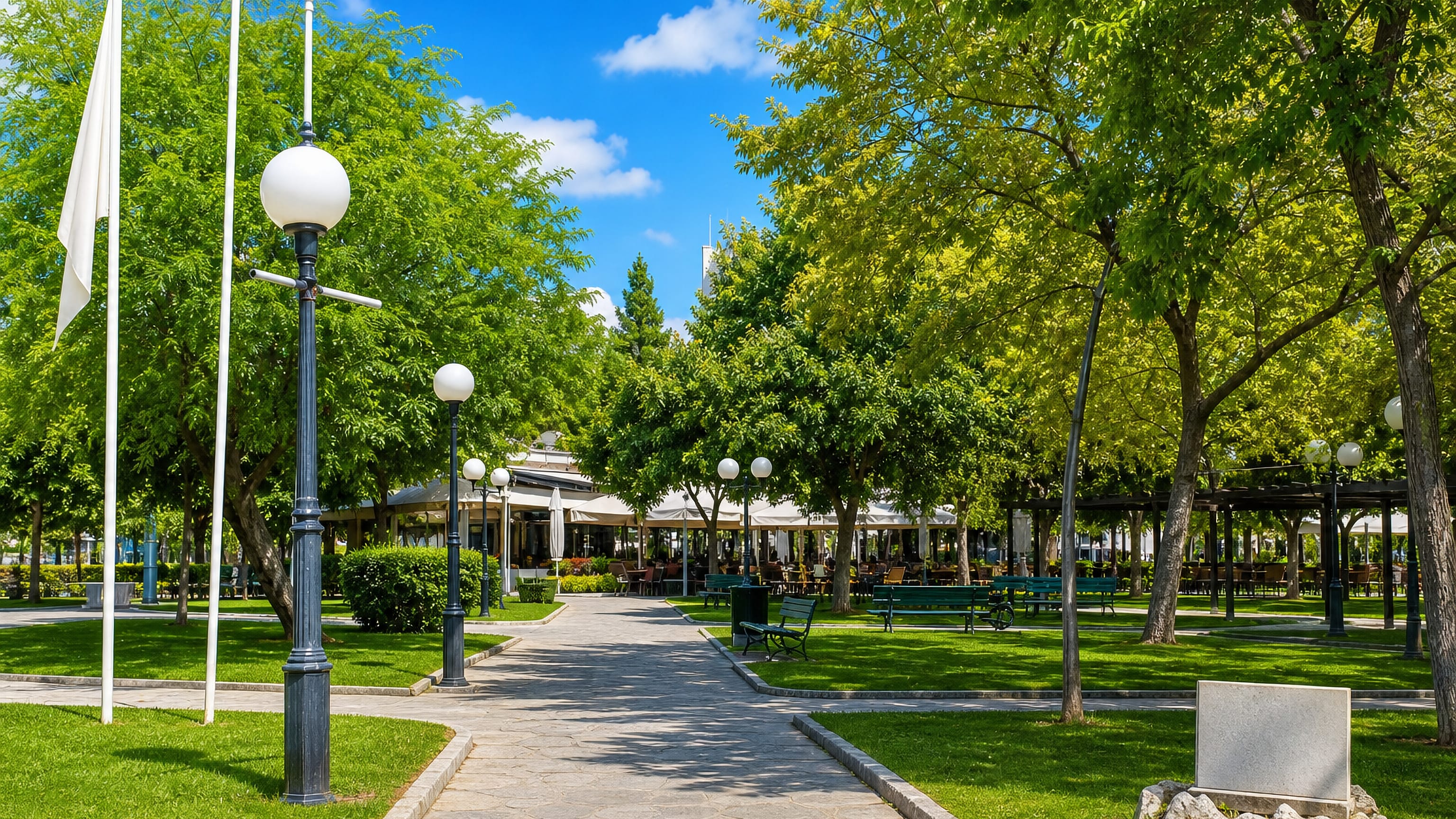 Shaded park with walkways, benches and a café pavilion in Maroúsi, a northern suburb of Athens