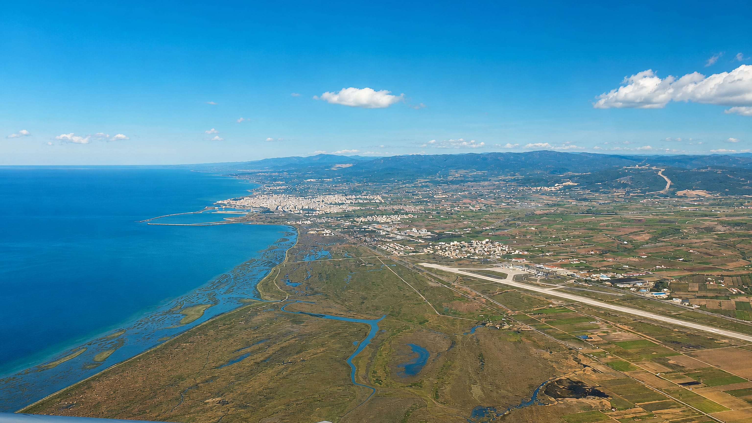Aerial view over the Evros coastal wetlands, airport and the town of Alexandroupoli in northern Greece.