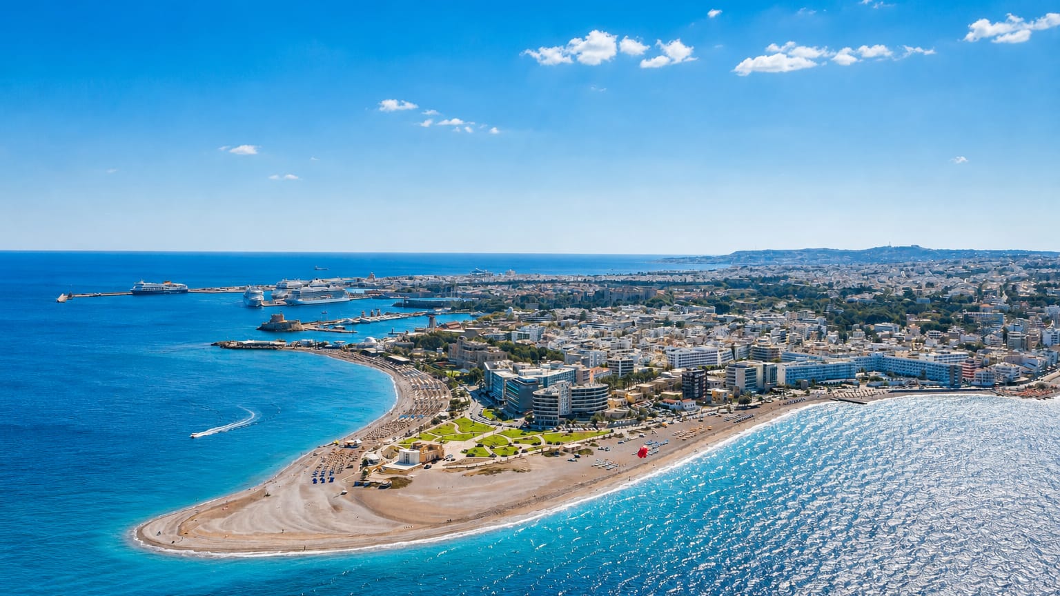 Aerial view of Rhodes town's northern beach spit and harbour with cruise ships on the Aegean.