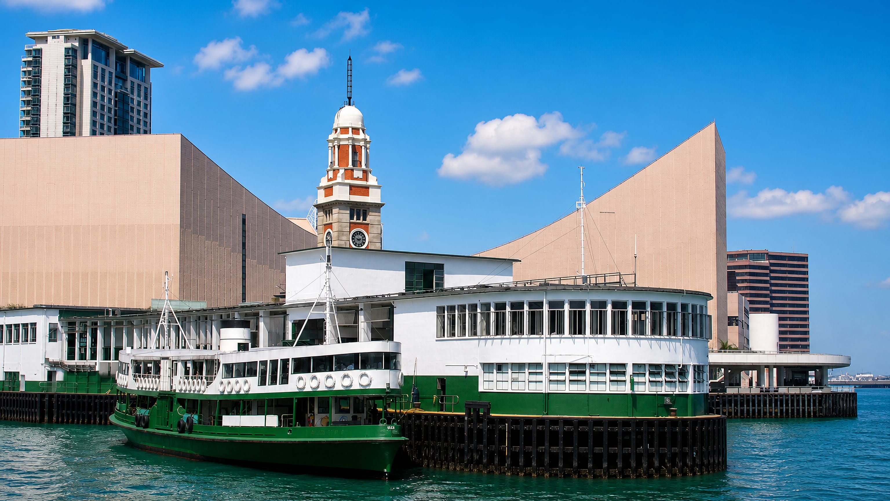 The Star Ferry pier and former KCR Clock Tower on the Tsim Sha Tsui waterfront in Kowloon, Hong Kong.