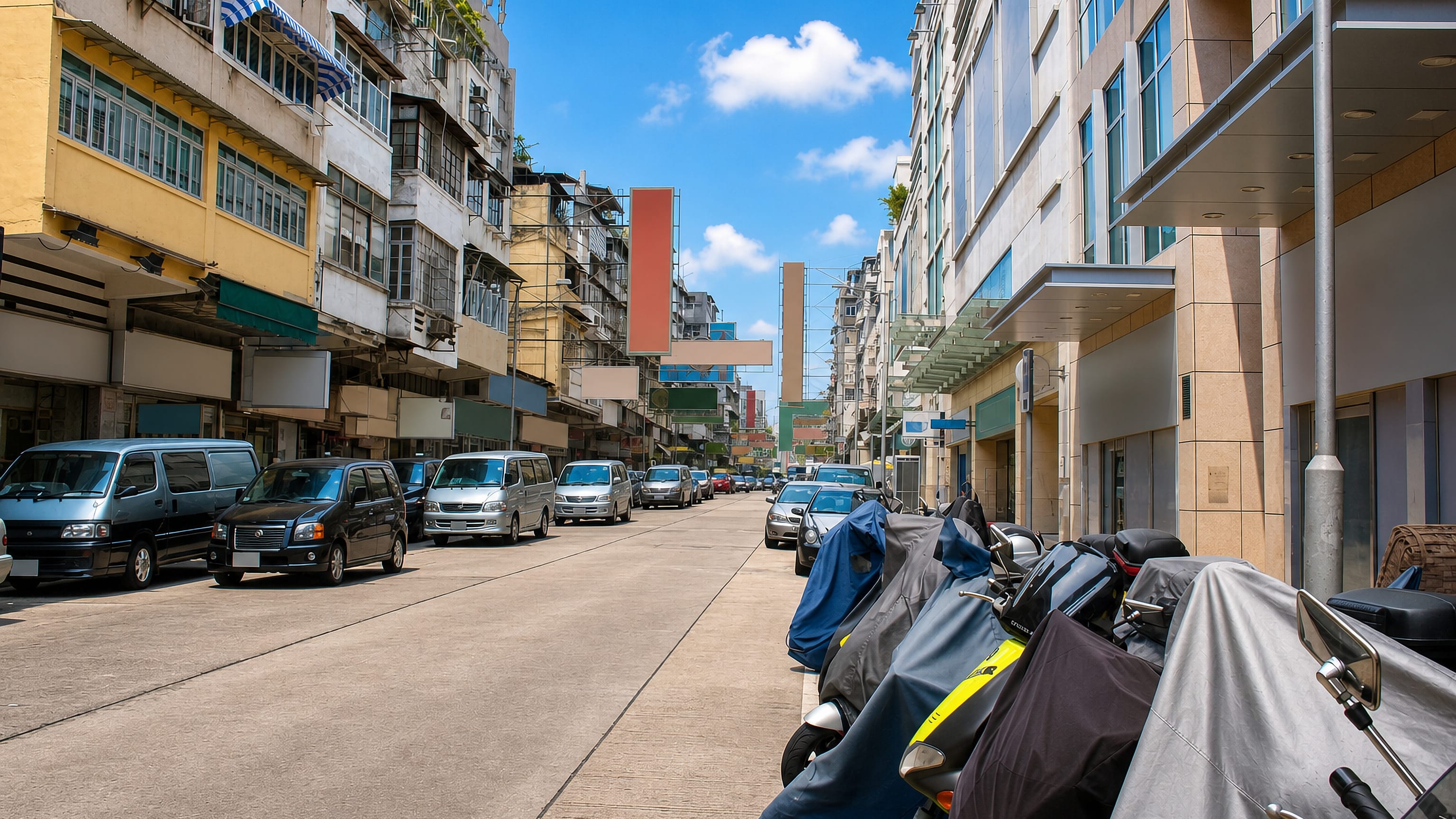 A narrow Kowloon City street in Hong Kong lined with old tenement blocks, parked vans and covered scooters.