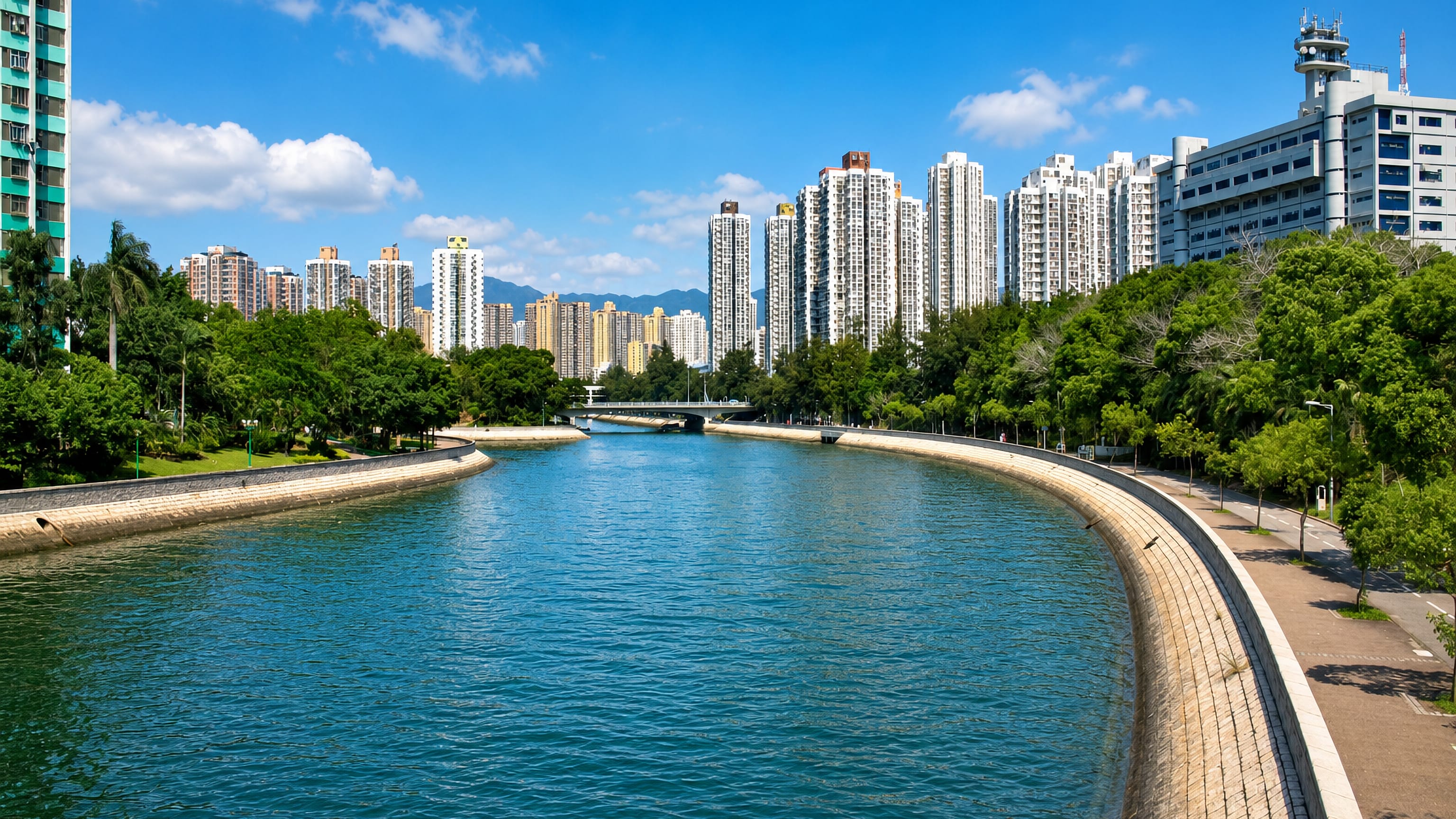 The channelled Lam Tsuen River in Tai Po, Hong Kong, lined with riverside promenades and high-rise housing estates