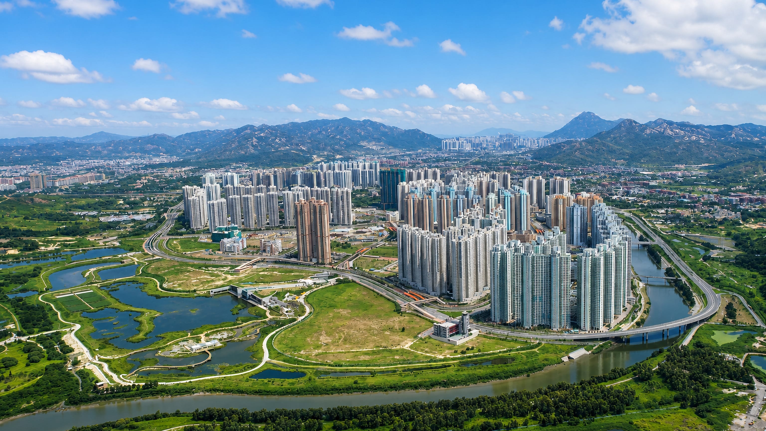 Tin Shui Wai new town, Hong Kong, high-rise estates ringed by wetland fish ponds and hills