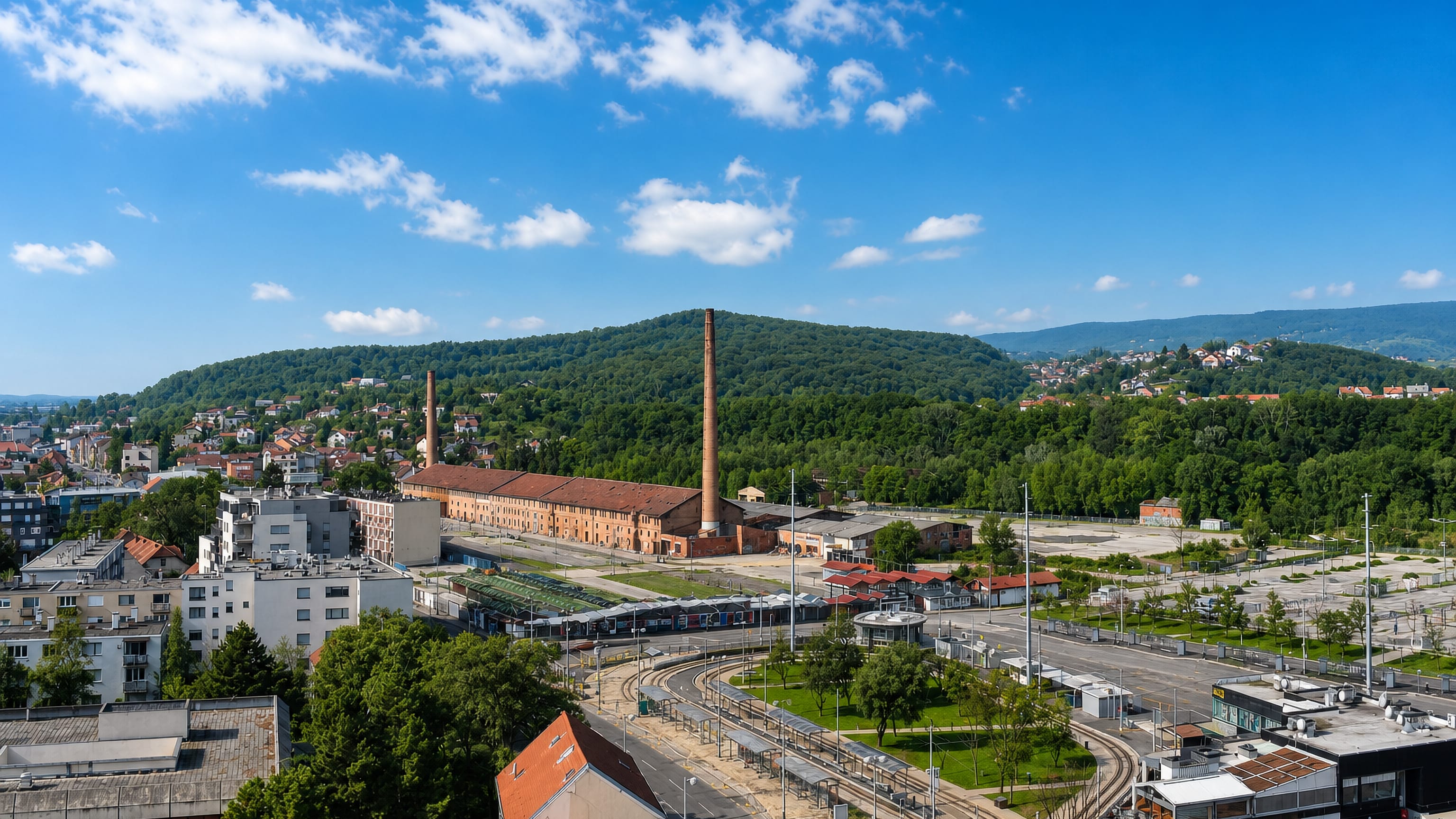 Črnomerec in Zagreb with its tram terminus, old brick factory chimneys and the wooded Medvednica slopes behind