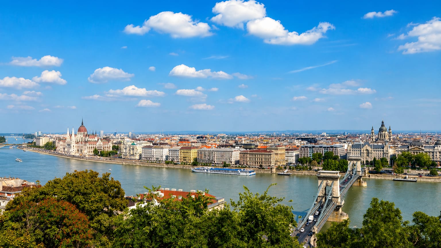 The Hungarian Parliament, Chain Bridge and St. Stephen's Basilica along the Danube in Budapest, viewed from Buda Castle hill.