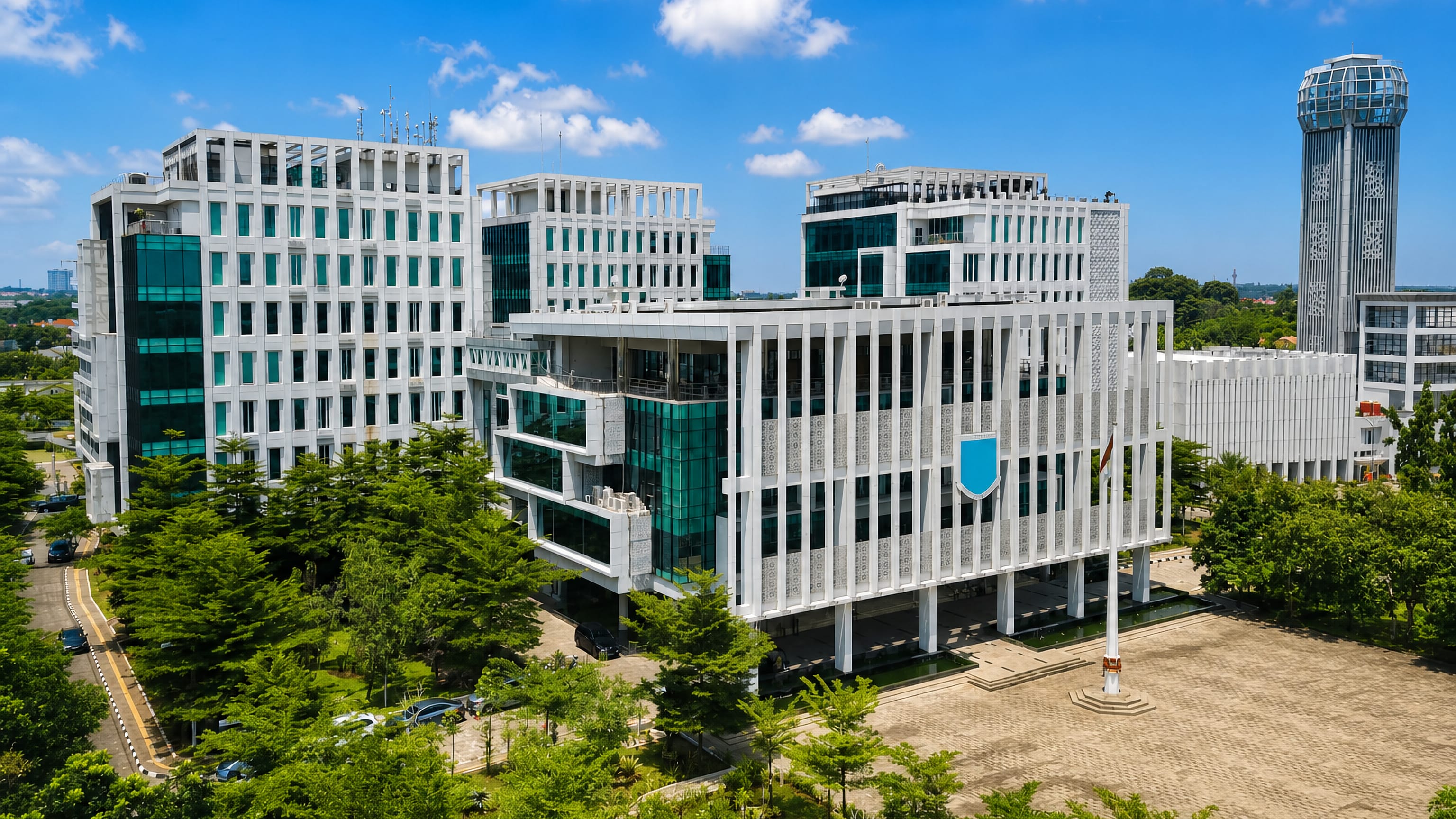 White civic towers of South Tangerang's government complex in Banten, crowned by a glass-topped tower