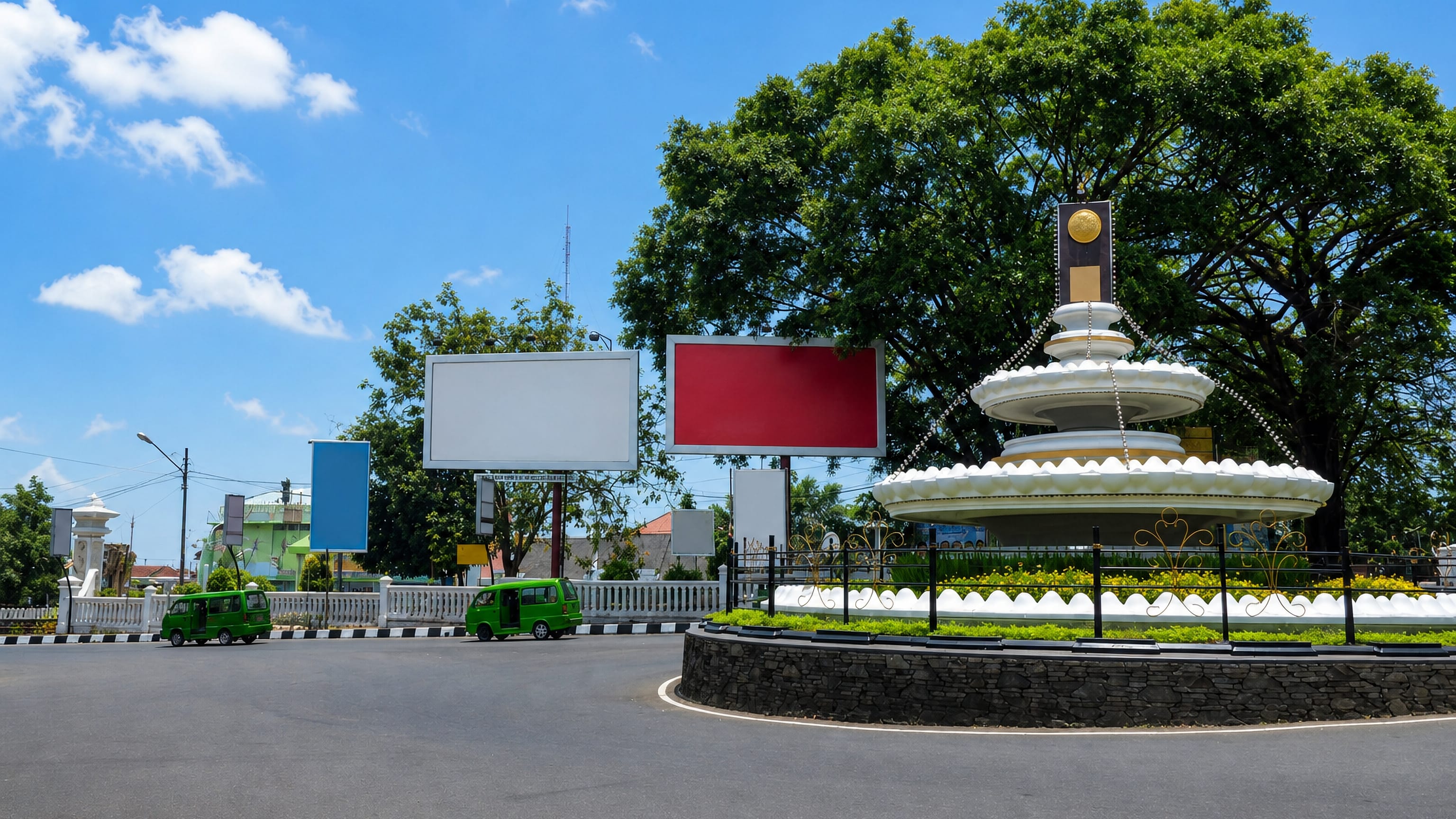 Roundabout with a white tiered monument and green minibuses in central Sukabumi, West Java.