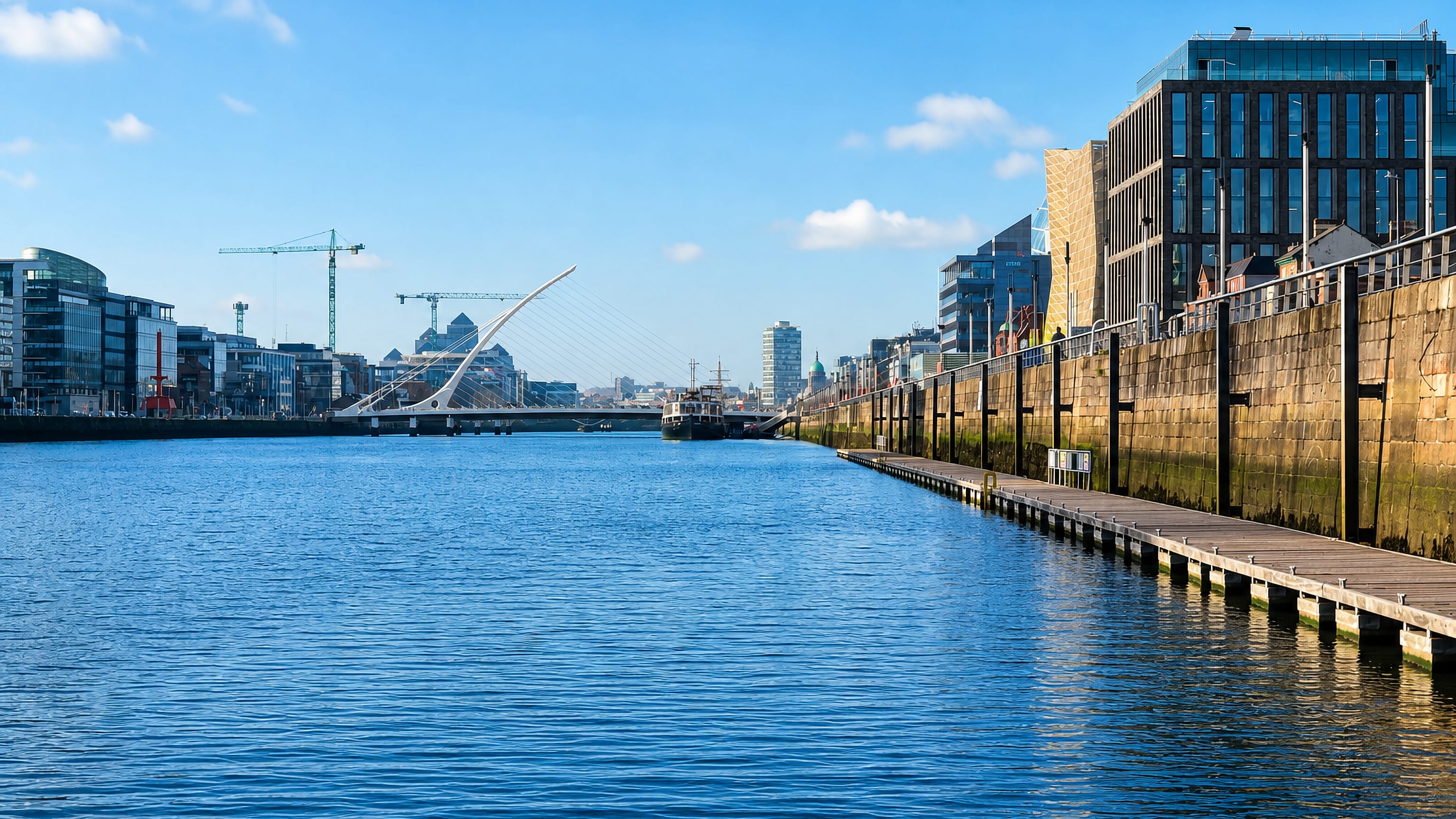 The Samuel Beckett Bridge and quayside offices along the River Liffey in the Dublin Docklands.