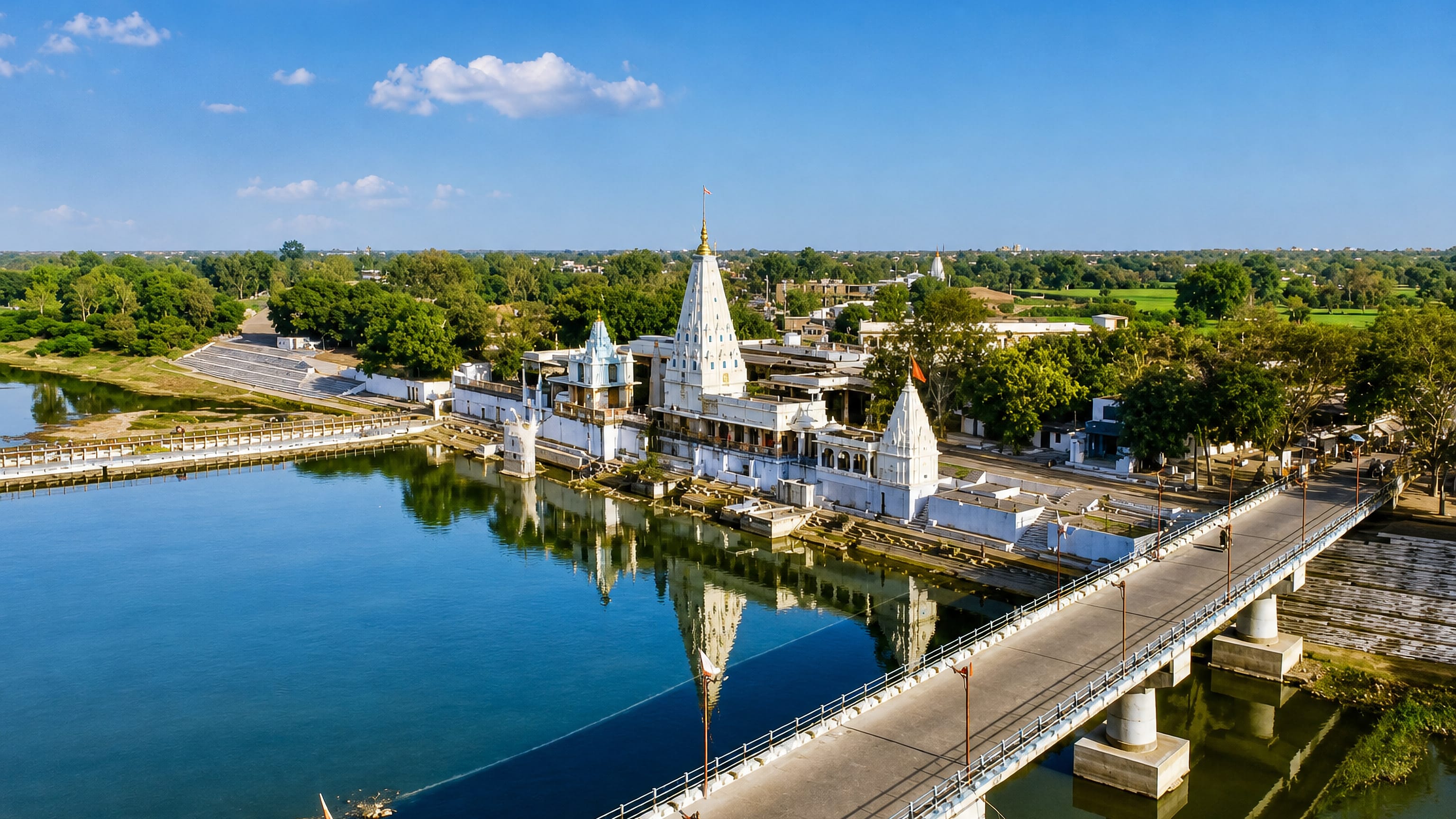White temple complex and riverside ghats beside the Shivna River bridge in Mandsaur, Madhya Pradesh.