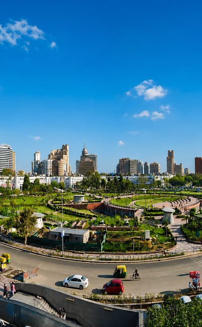 Connaught Place in New Delhi, its circular colonnaded blocks and central park ringed by traffic and rickshaws.