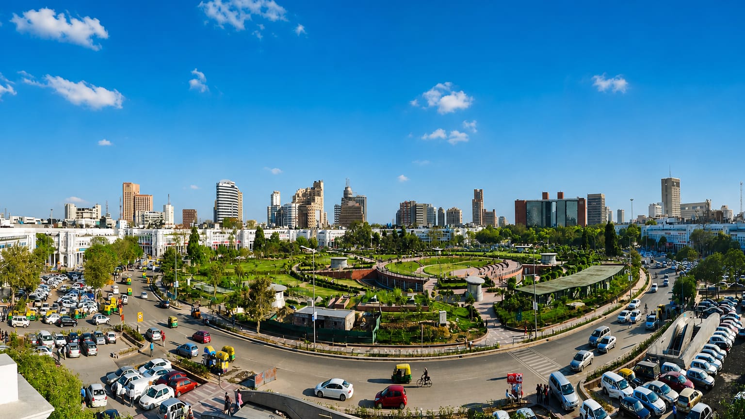 Connaught Place in New Delhi, its circular colonnaded blocks and central park ringed by traffic and rickshaws.