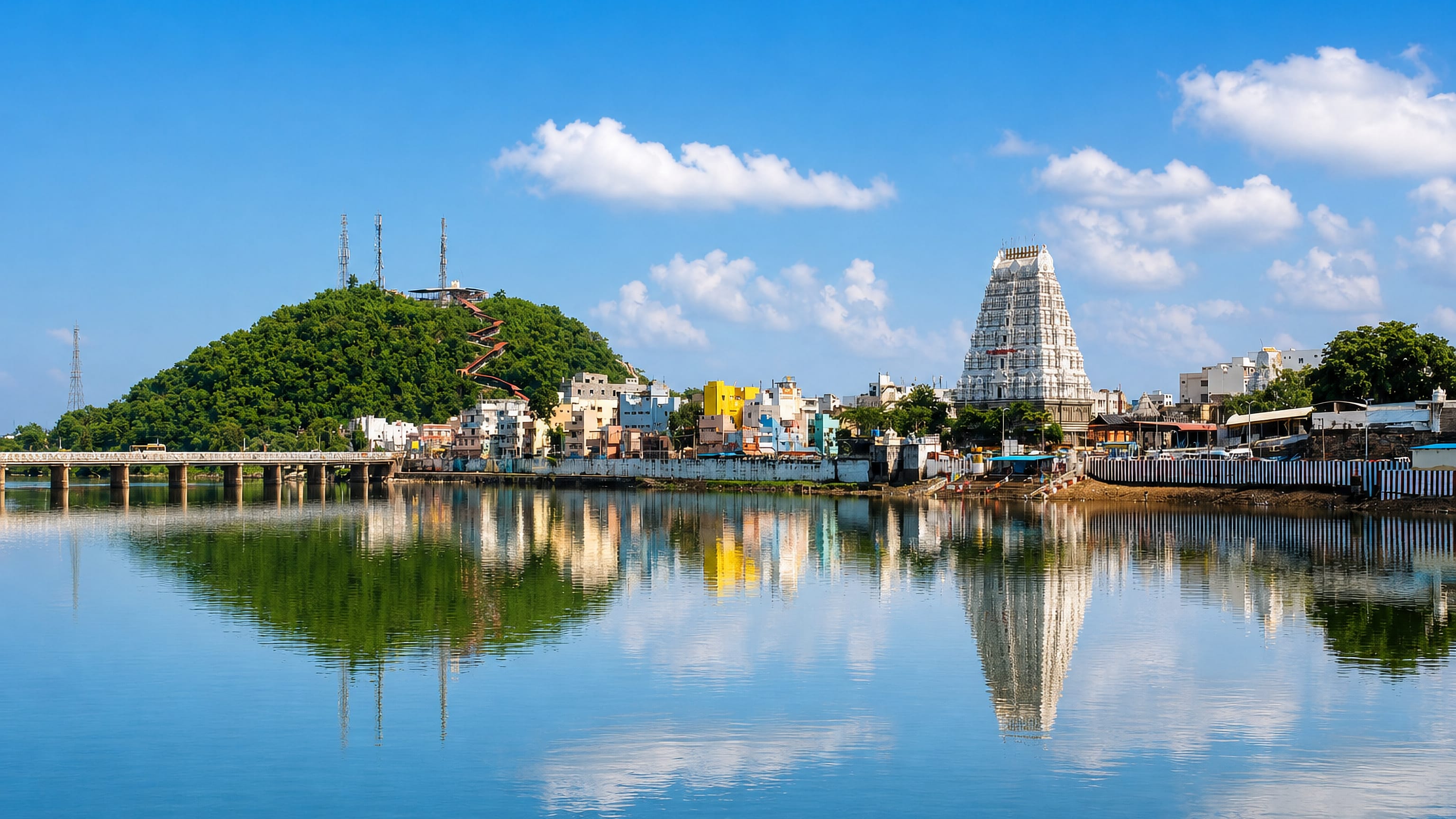 The white gopuram of Srikalahasti's temple town reflected in the Swarnamukhi river below the temple hill.