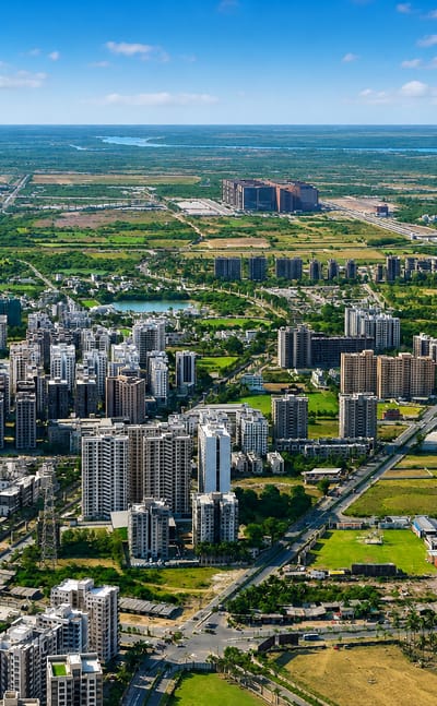 Aerial view of Surat's mid-rise apartments and greenery stretching to the horizon