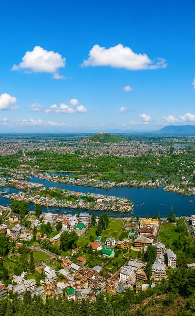 Aerial view of Srinagar with Dal Lake, houseboats and waterways ringed by hills