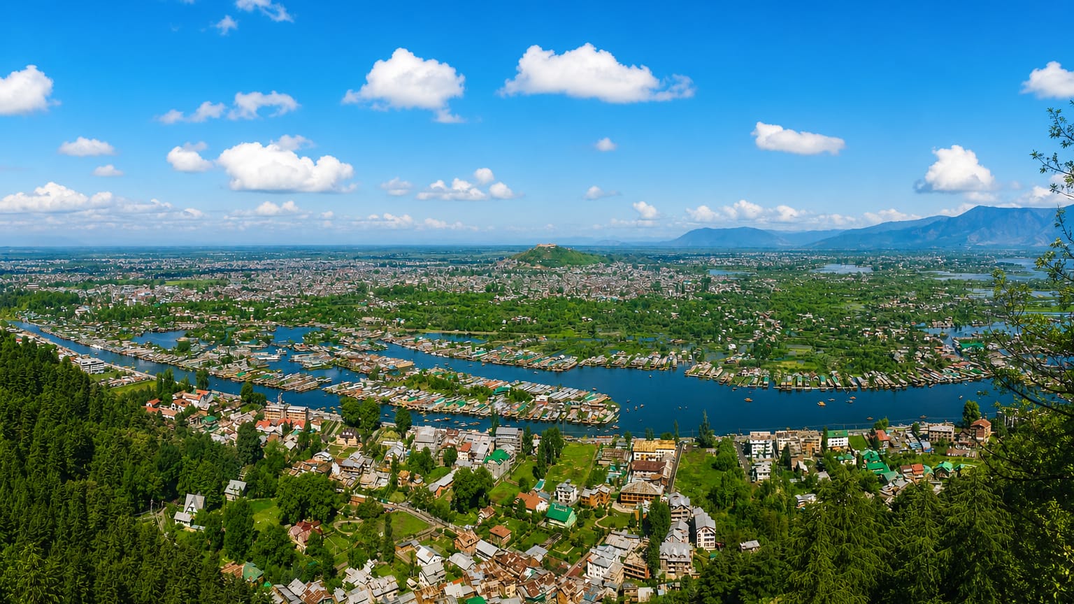 Aerial view of Srinagar with Dal Lake, houseboats and waterways ringed by hills
