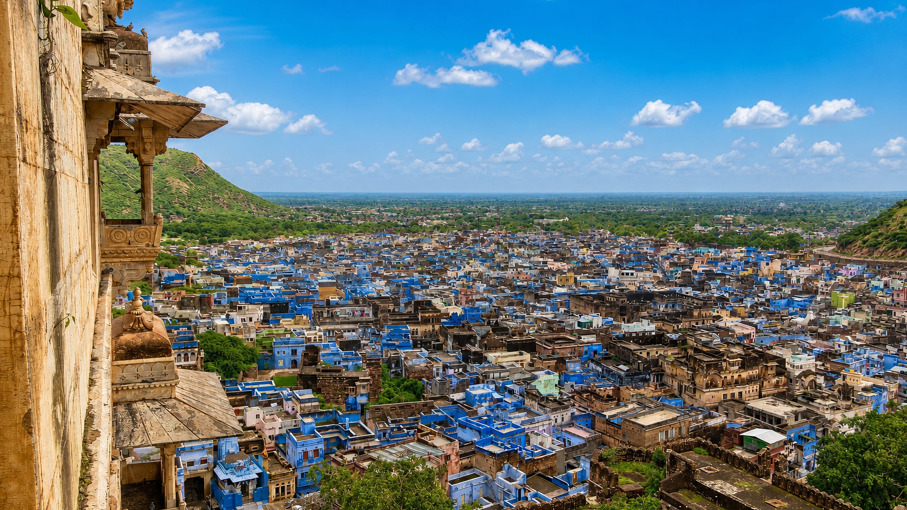 Blue-painted houses of Bundi, Rajasthan, seen from a carved sandstone balcony of the hilltop palace