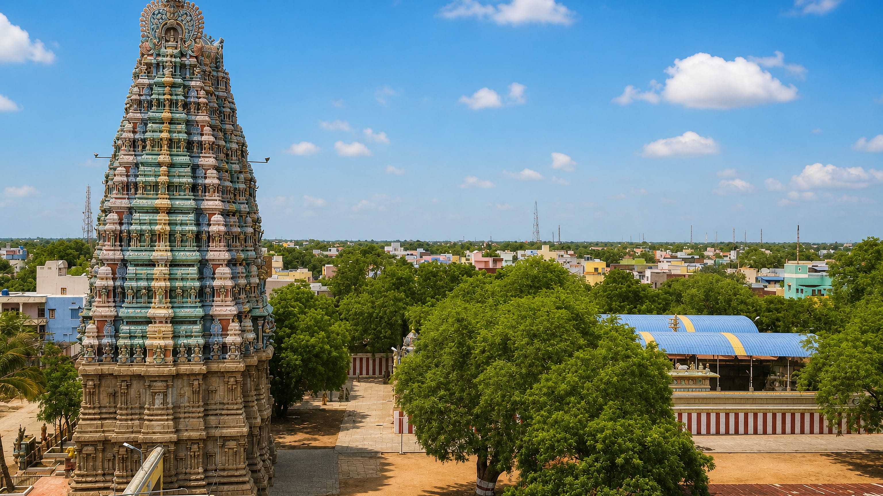 A colourful Dravidian temple gopuram rises above the low rooftops of Sivakasi, Tamil Nadu.