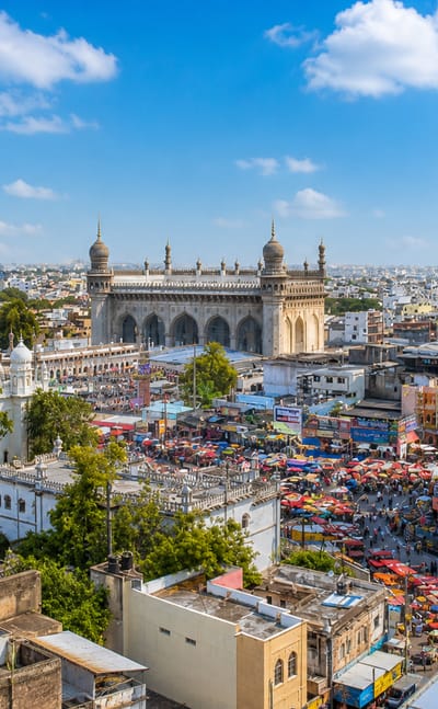 The Charminar and Mecca Masjid amid the bustling bazaars of Hyderabad's Old City