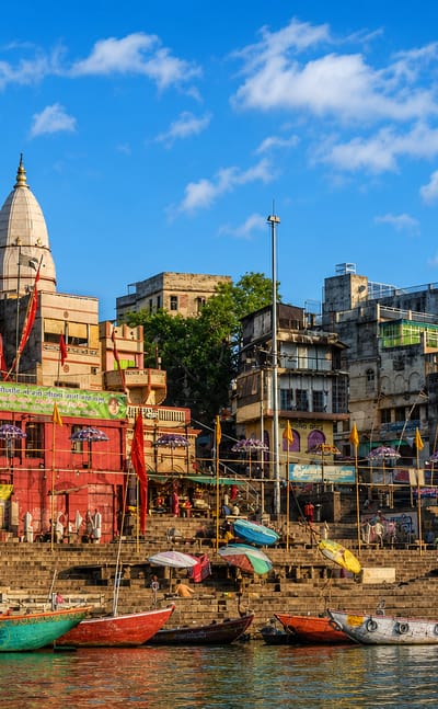 Temples, spires and moored boats along the Ganges riverfront ghats of Varanasi, India