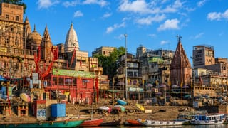 Temples, spires and moored boats along the Ganges riverfront ghats of Varanasi, India