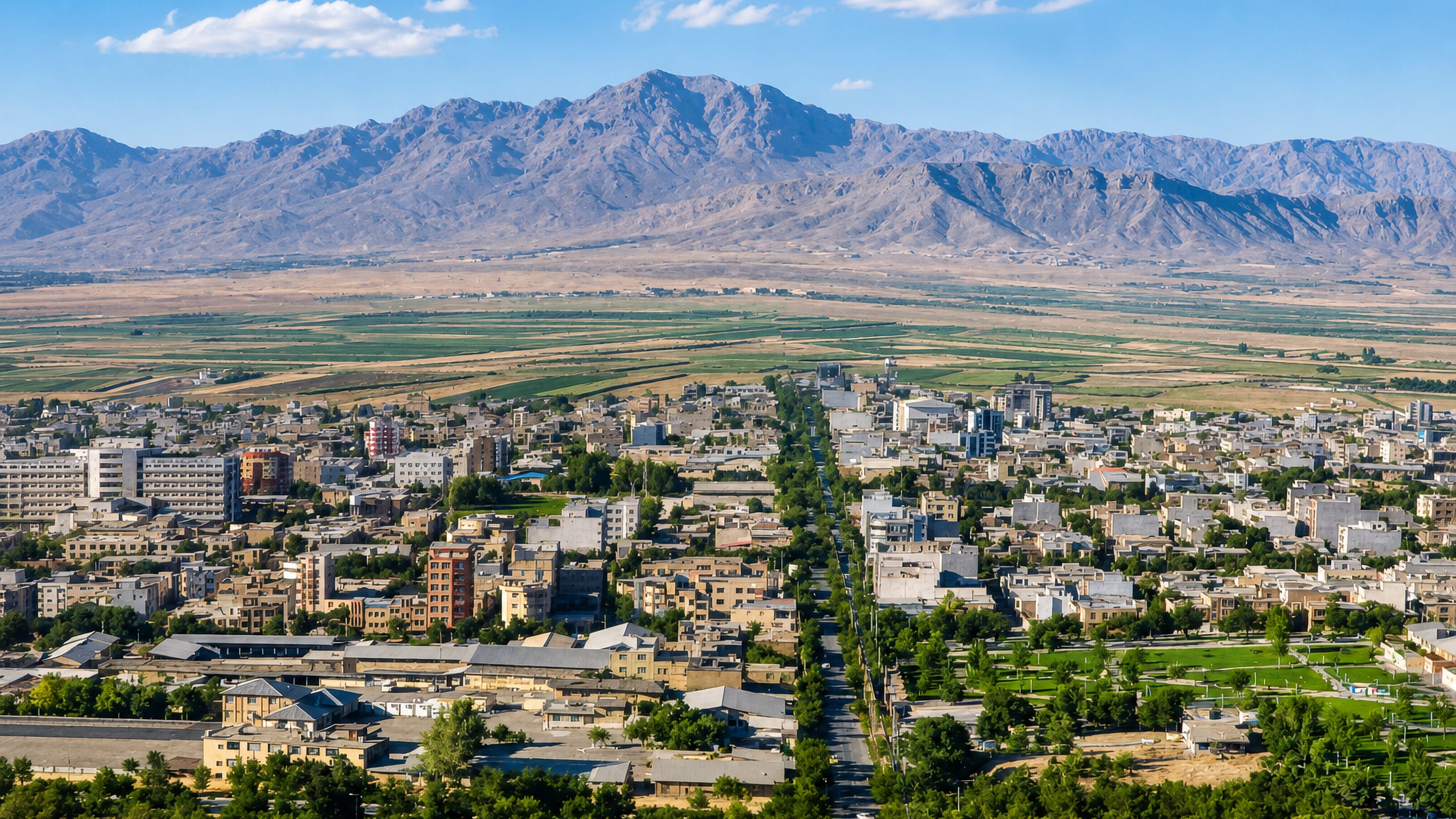 Shahr-e Kord, Iran, spread across its high plain with a tree-lined boulevard and Zagros ridges behind