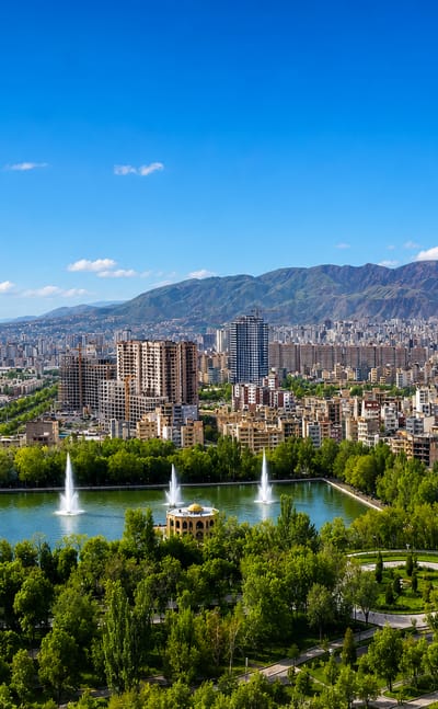 El Goli park lake and pavilion with fountains below the city and mountains, Tabriz, Iran
