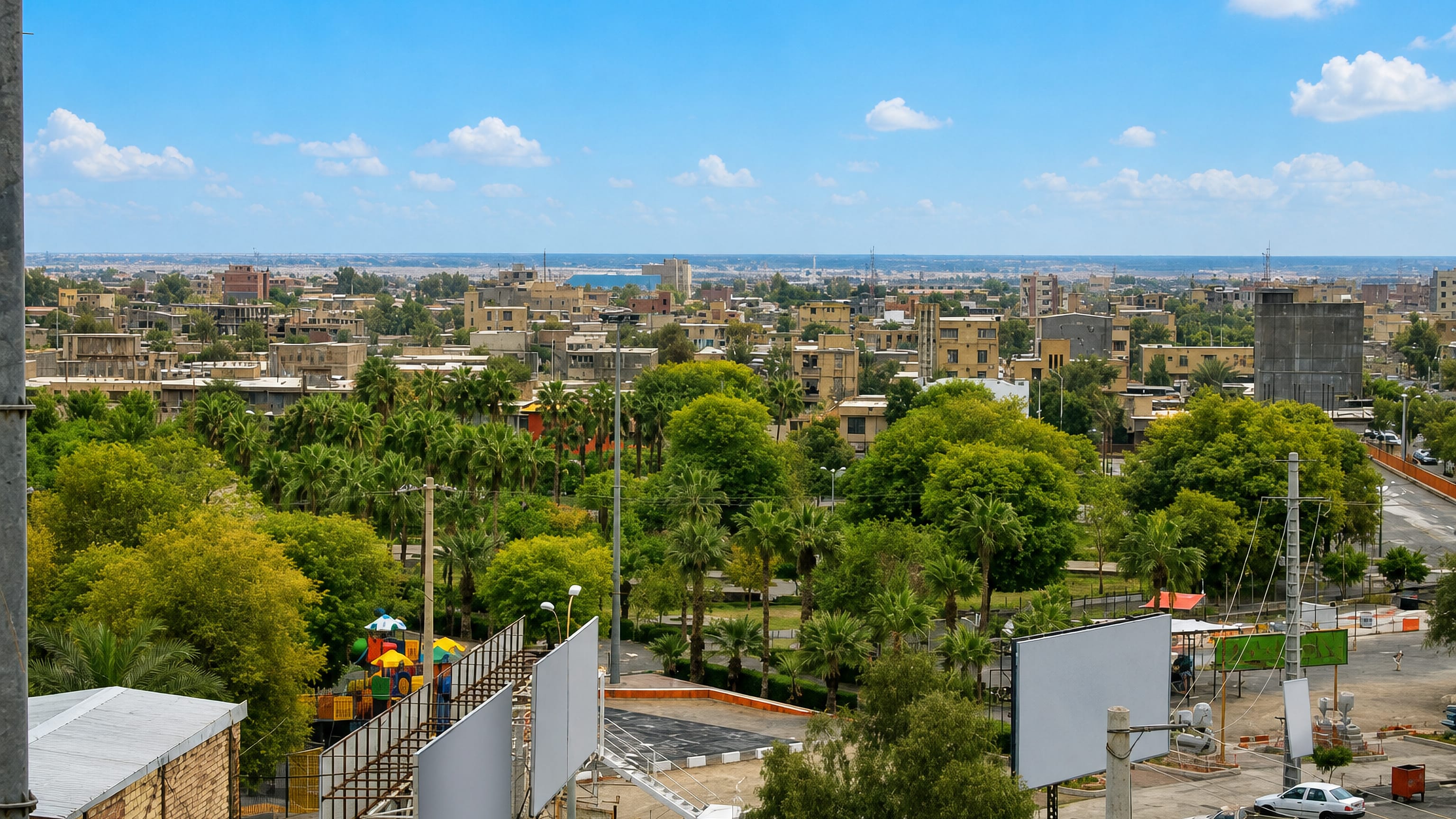 Jiroft, Iran, its low ochre buildings and date-palm groves stretching to a hazy horizon.