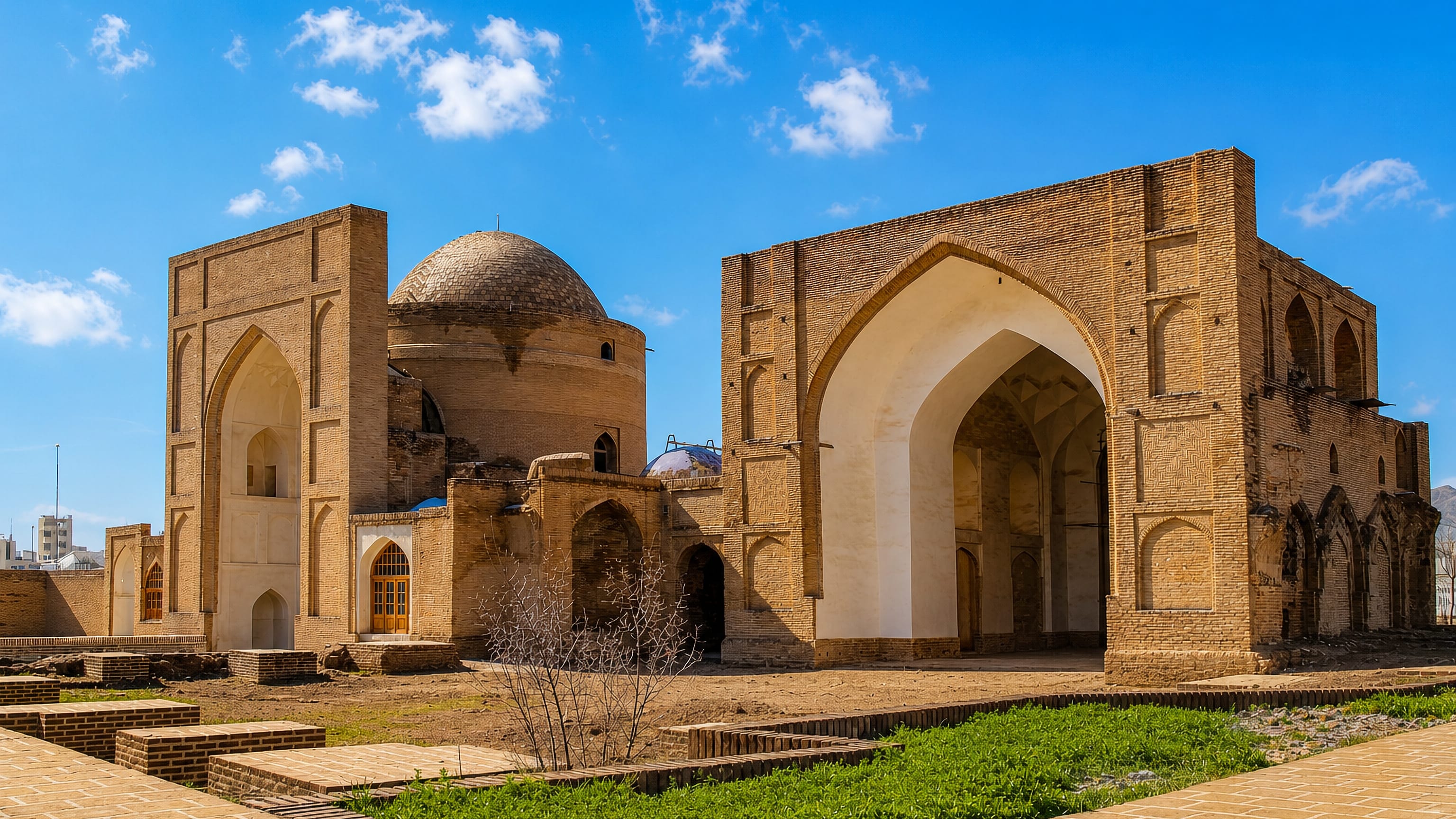 Brick iwans and the domed shrine of the historic mausoleum complex in Torbat-e Heydariyeh, Iran.