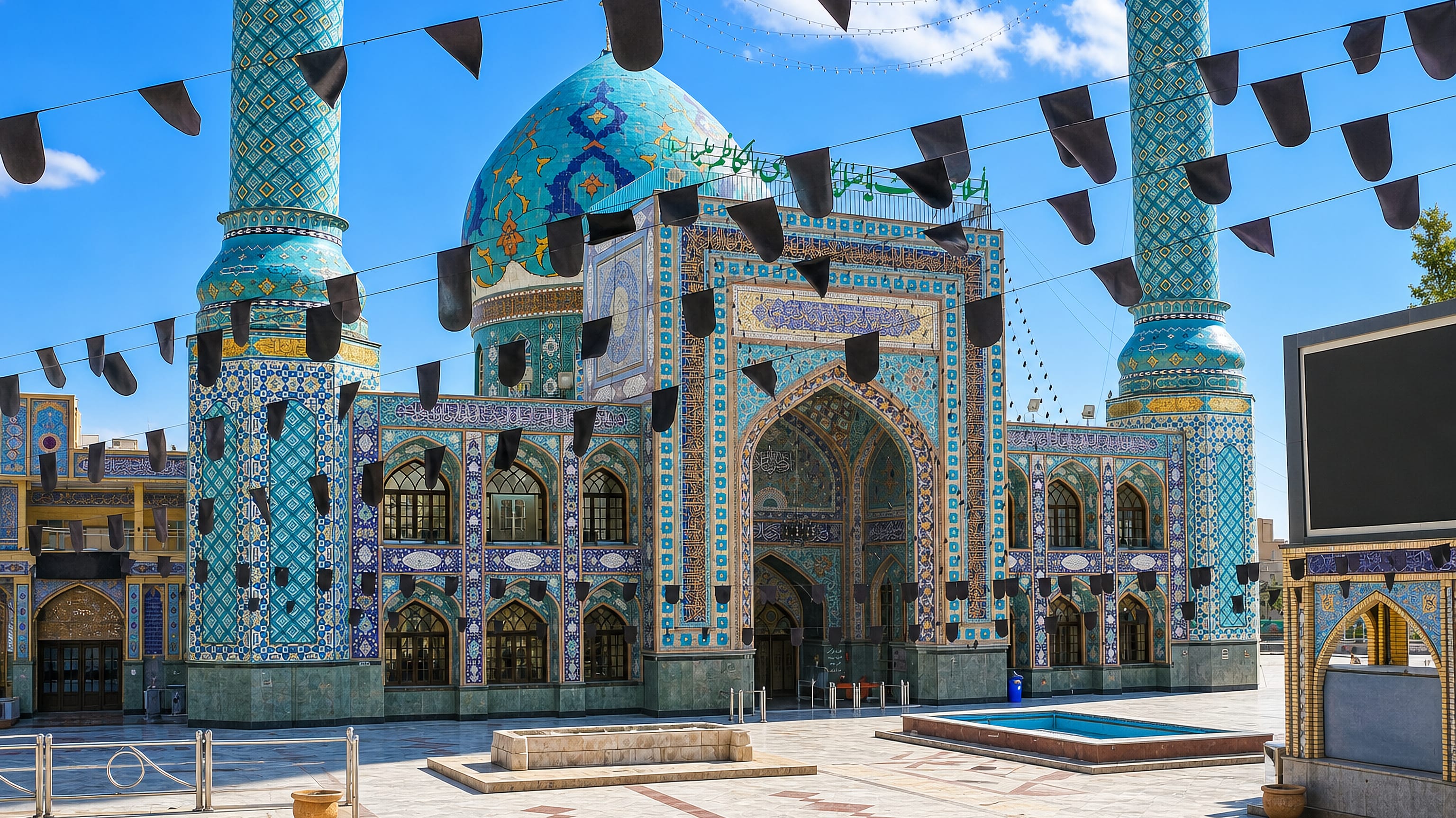 The turquoise-tiled dome and minarets of the shrine at the heart of Tajrish, northern Tehran.