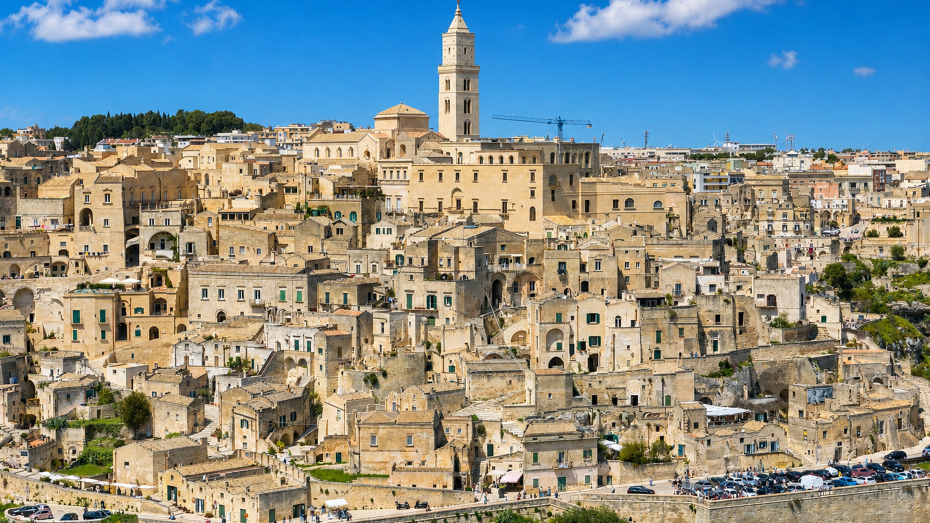 Matera's Sassi districts of stacked stone cave dwellings rising to the cathedral campanile