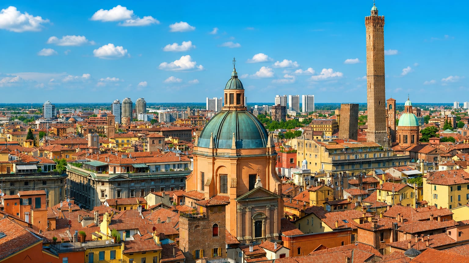 Bologna skyline with its leaning medieval Two Towers, a green-domed church and terracotta rooftops