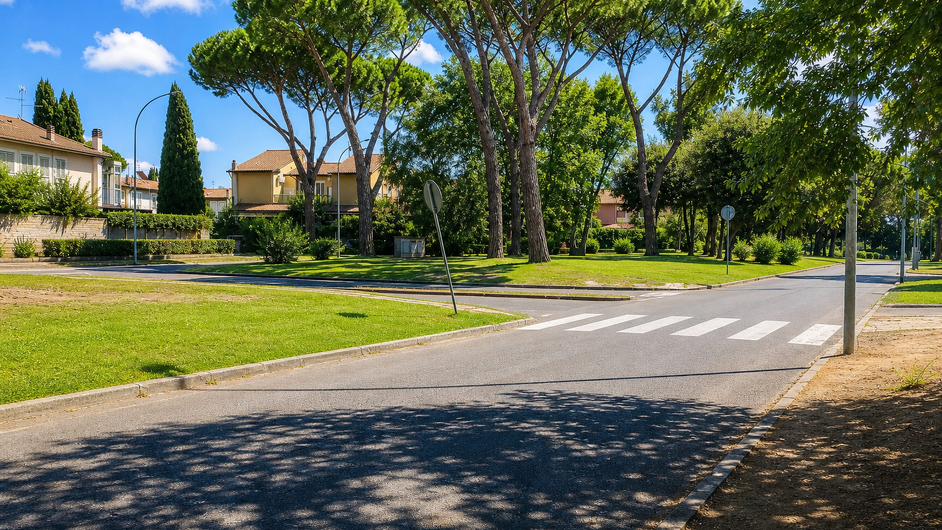 Quiet residential street lined with umbrella pines and tile-roofed villas in Casal Palocco, southern Rome.