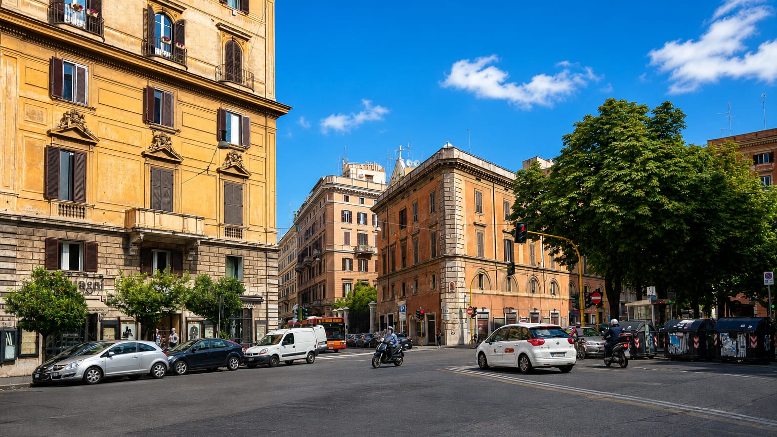 Sunlit street corner in Rome with ochre palazzi, parked cars and a clear blue sky in the Castro Pretorio quarter