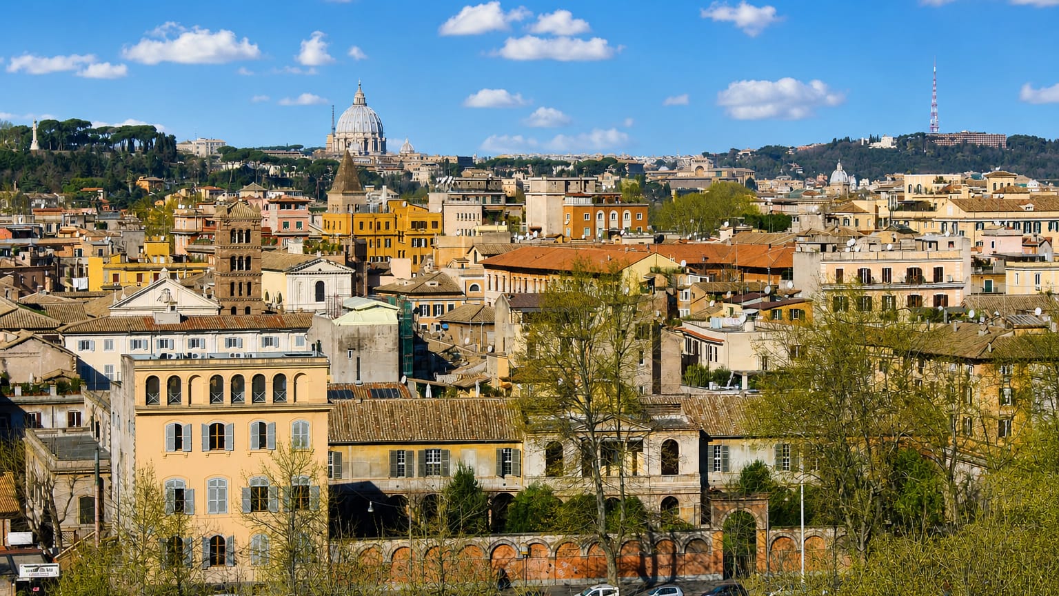 Trastevere's terracotta rooftops and a Romanesque bell tower in Rome below the dome of St. Peter's Basilica under a blue sky