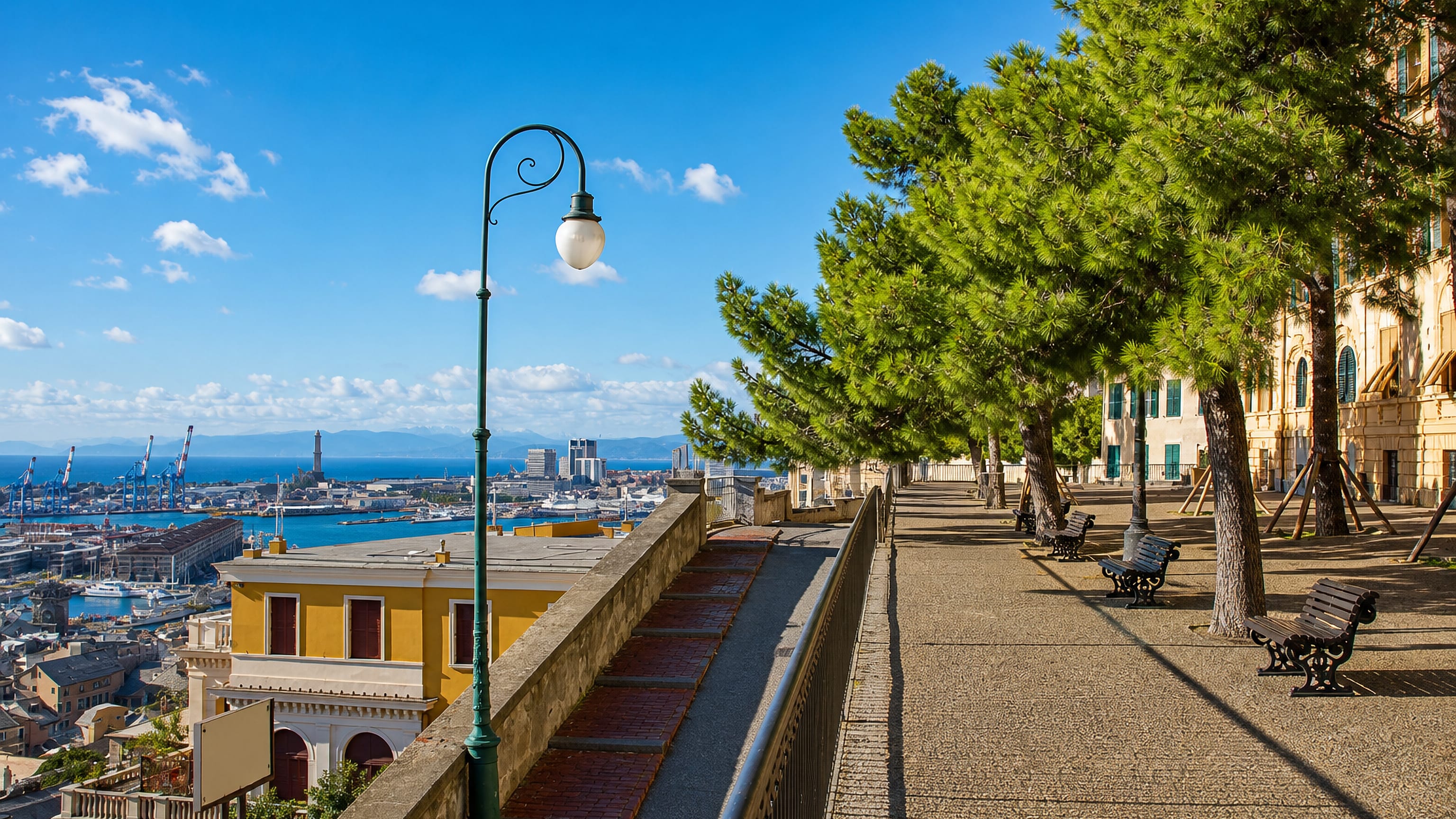 The Spianata Castelletto terrace in Genoa overlooking the old port and the Lanterna lighthouse.